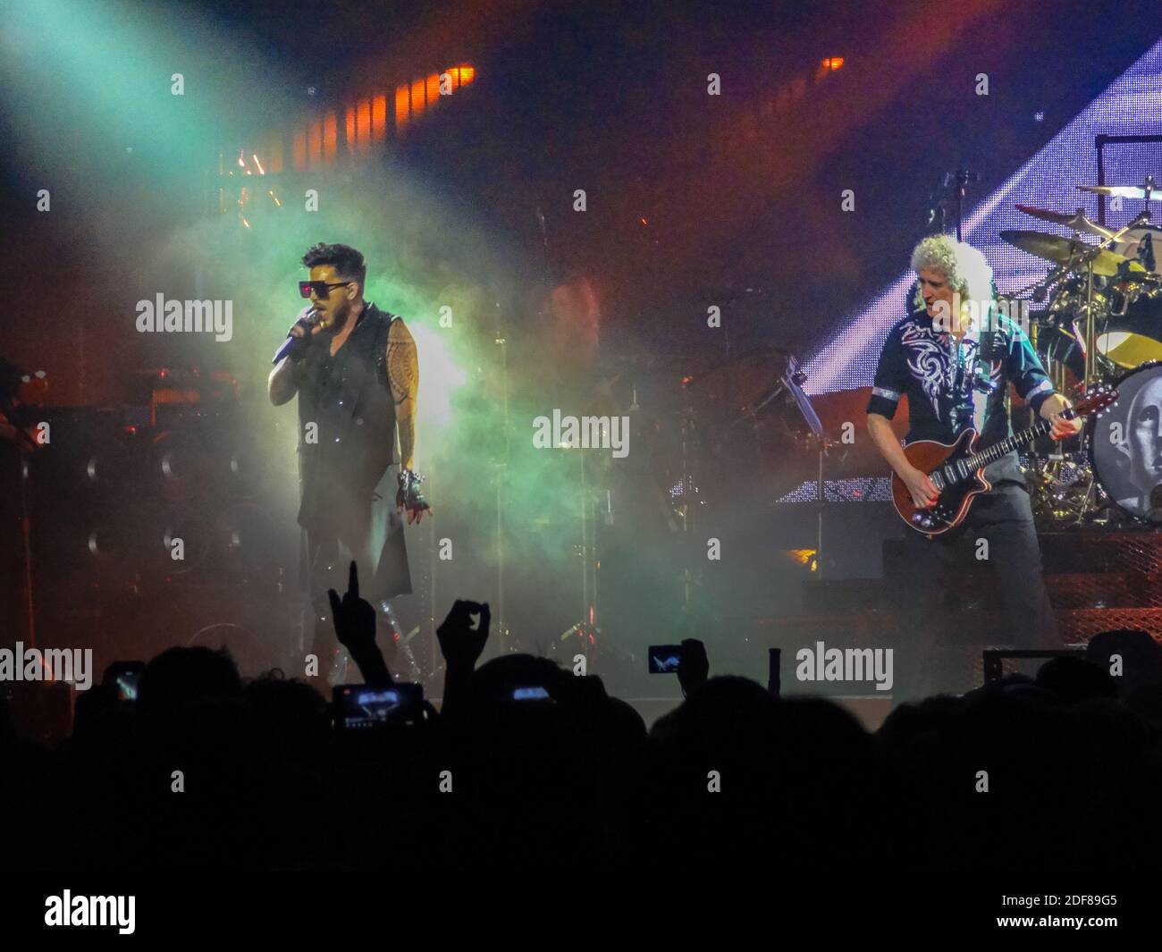 Queen's Brian May and Adam Lambert on stage at a concert in London Stock Photo