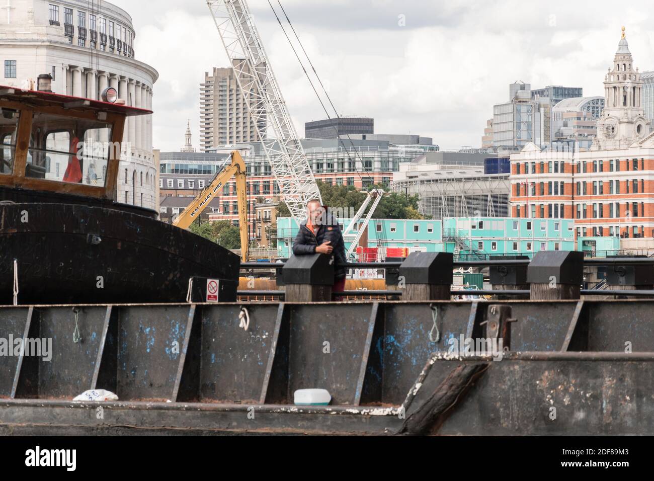 A beached dredger on the banks of the River Thames Stock Photo