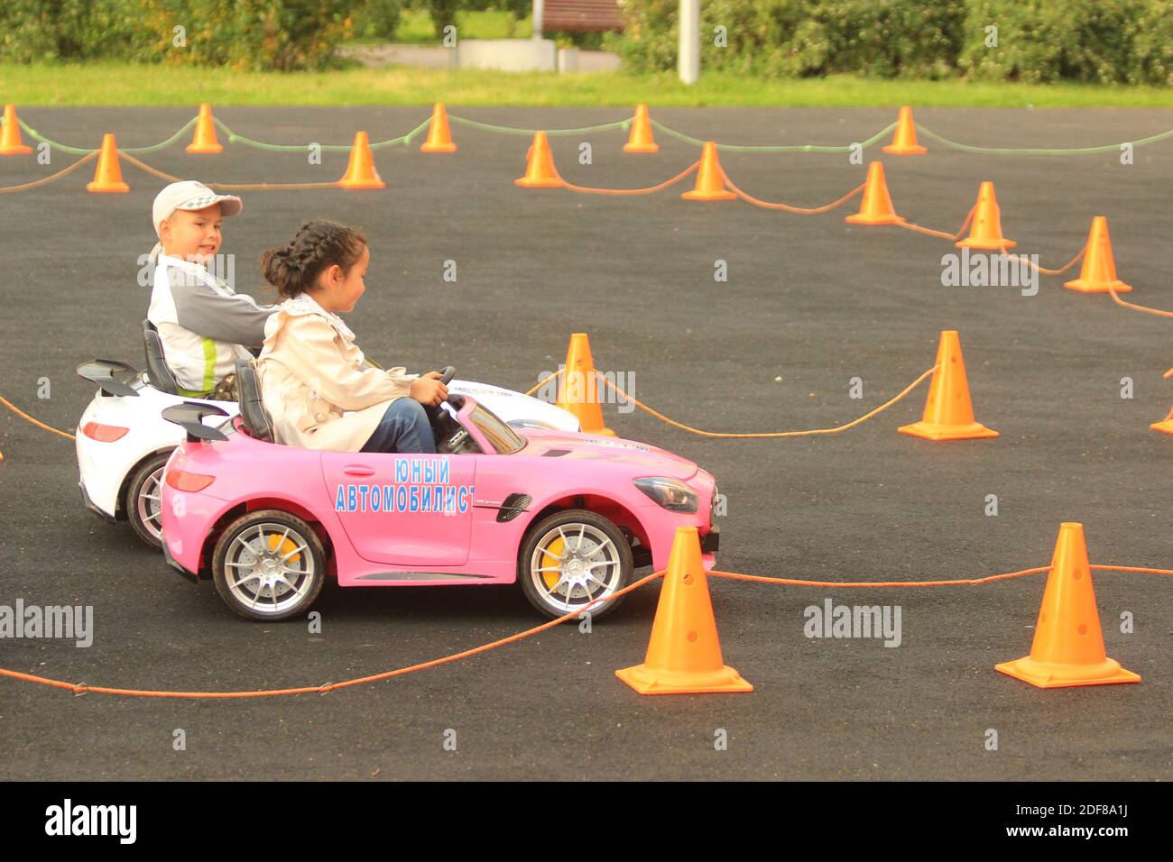 Training session children electric cars on local sportground.Little boy