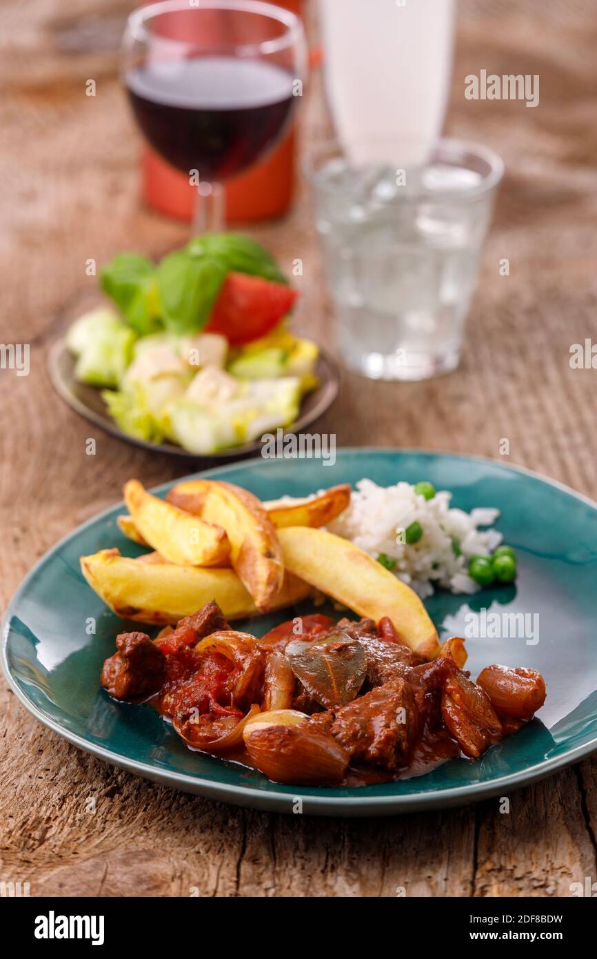greek stifado meat stew with fries Stock Photo Alamy