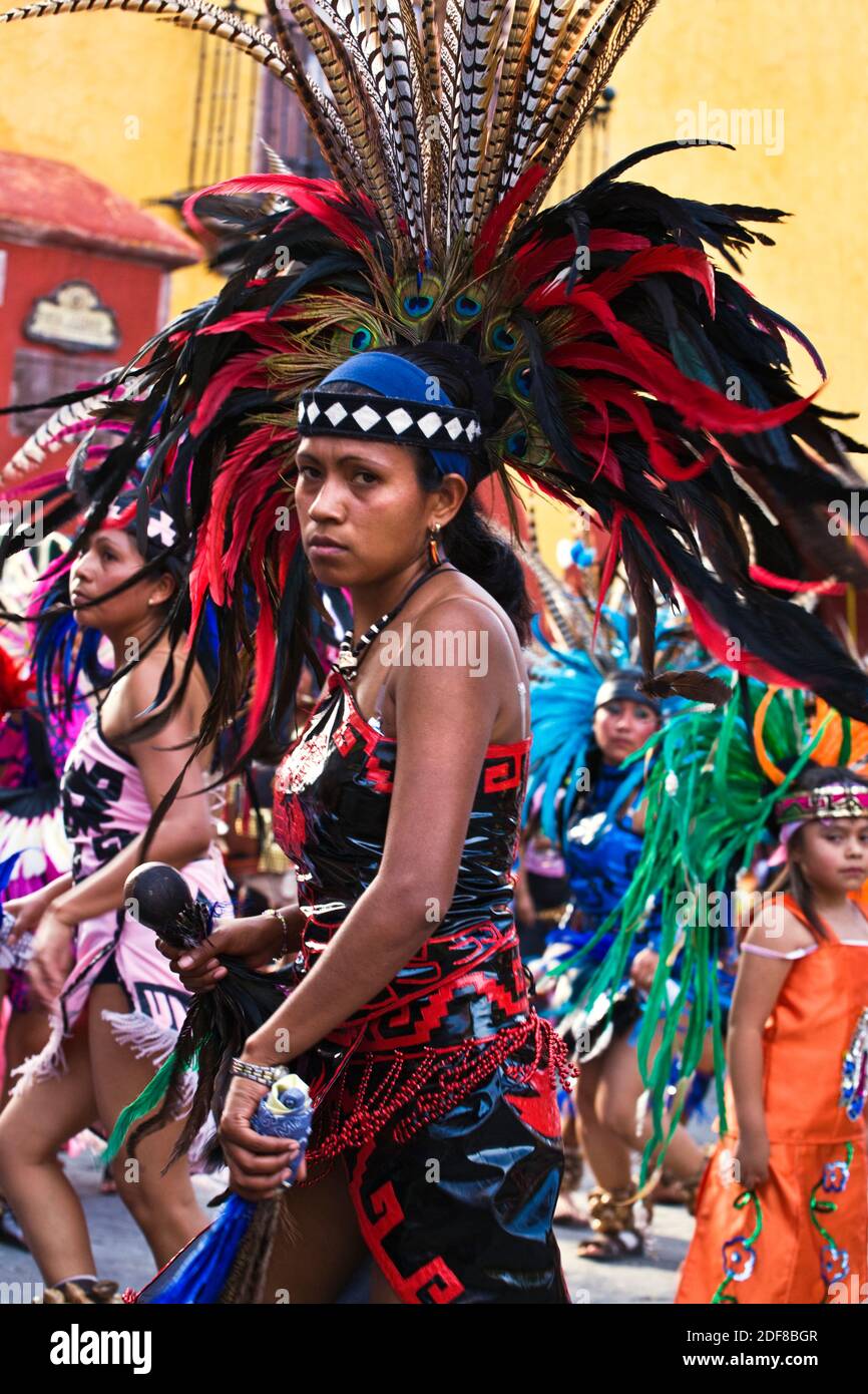 Costumed and feathered indigenous dancers from all parts of Mexico participate in the annual INDEPENDENCE DAY PARADE in September - SAN MIGUEL DE ALLE Stock Photo