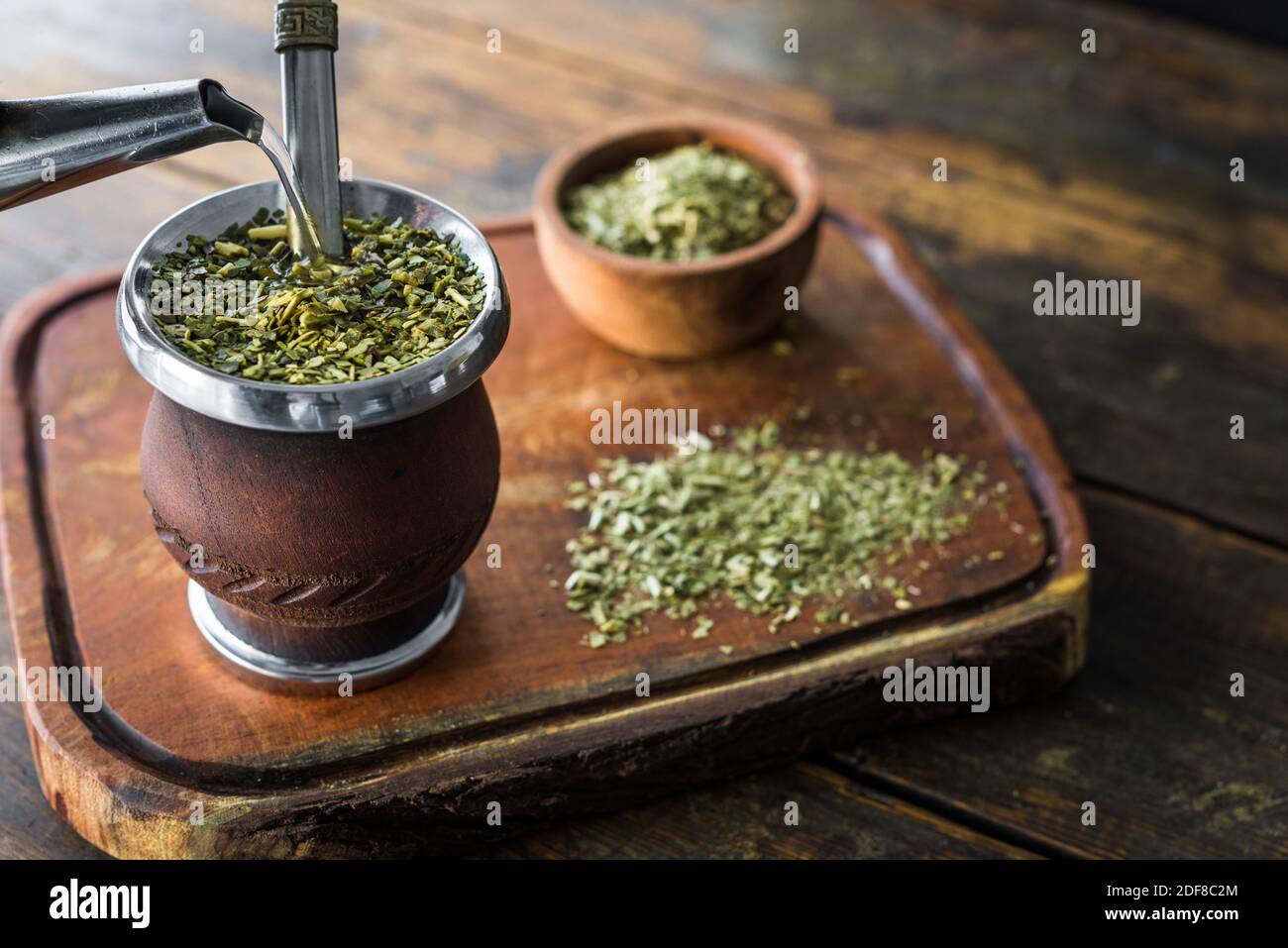 Traditional Argentinian yerba mate tea in a calabash gourd with bombilla stick. Stock Photo