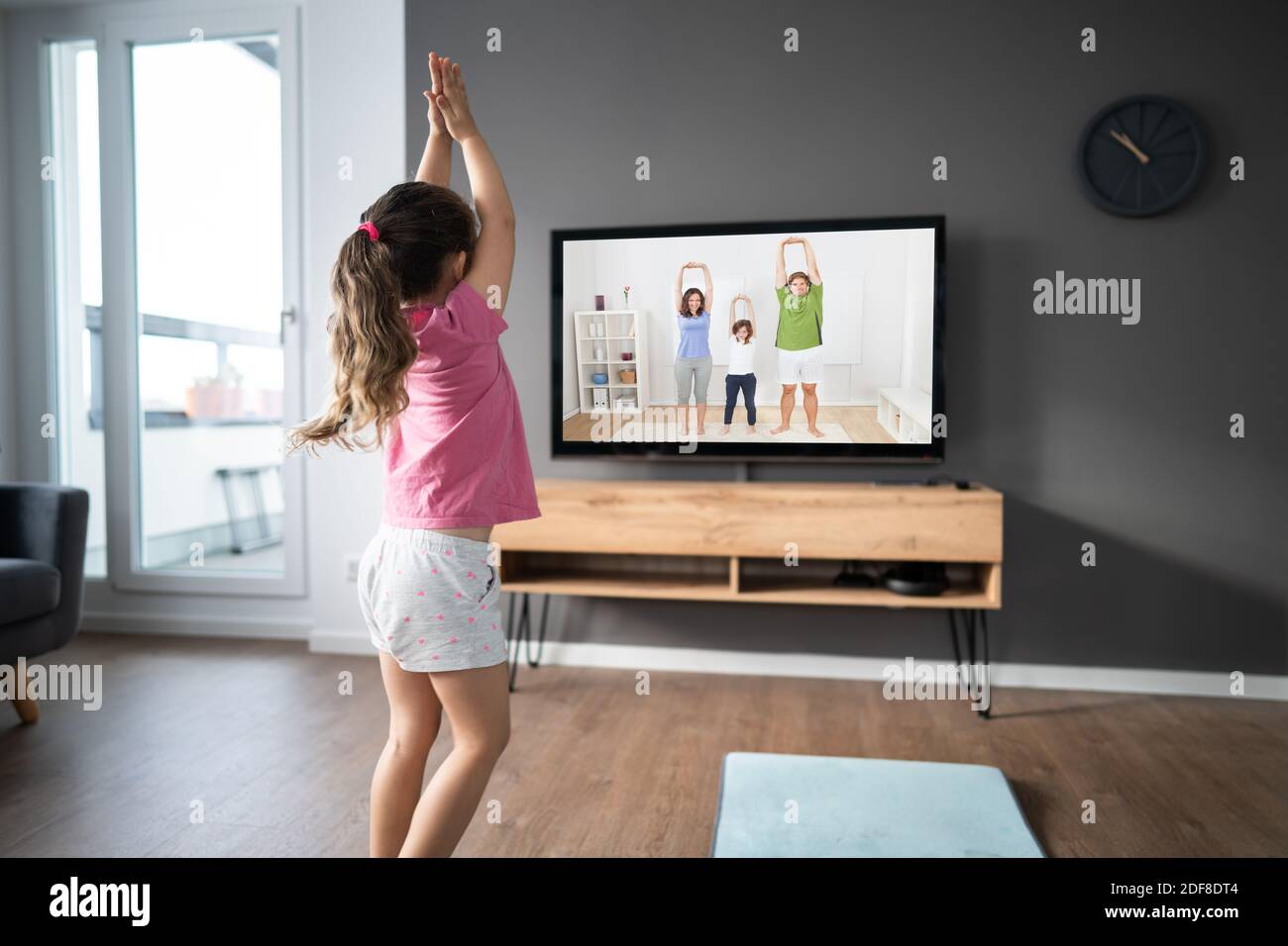 Kid Doing Online TV Fitness Exercise At Home Stock Photo Alamy