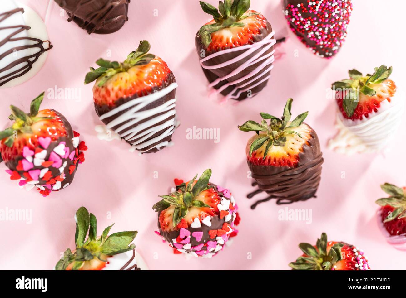 Variety of chocolate dipped strawberries on a pink background Stock ...