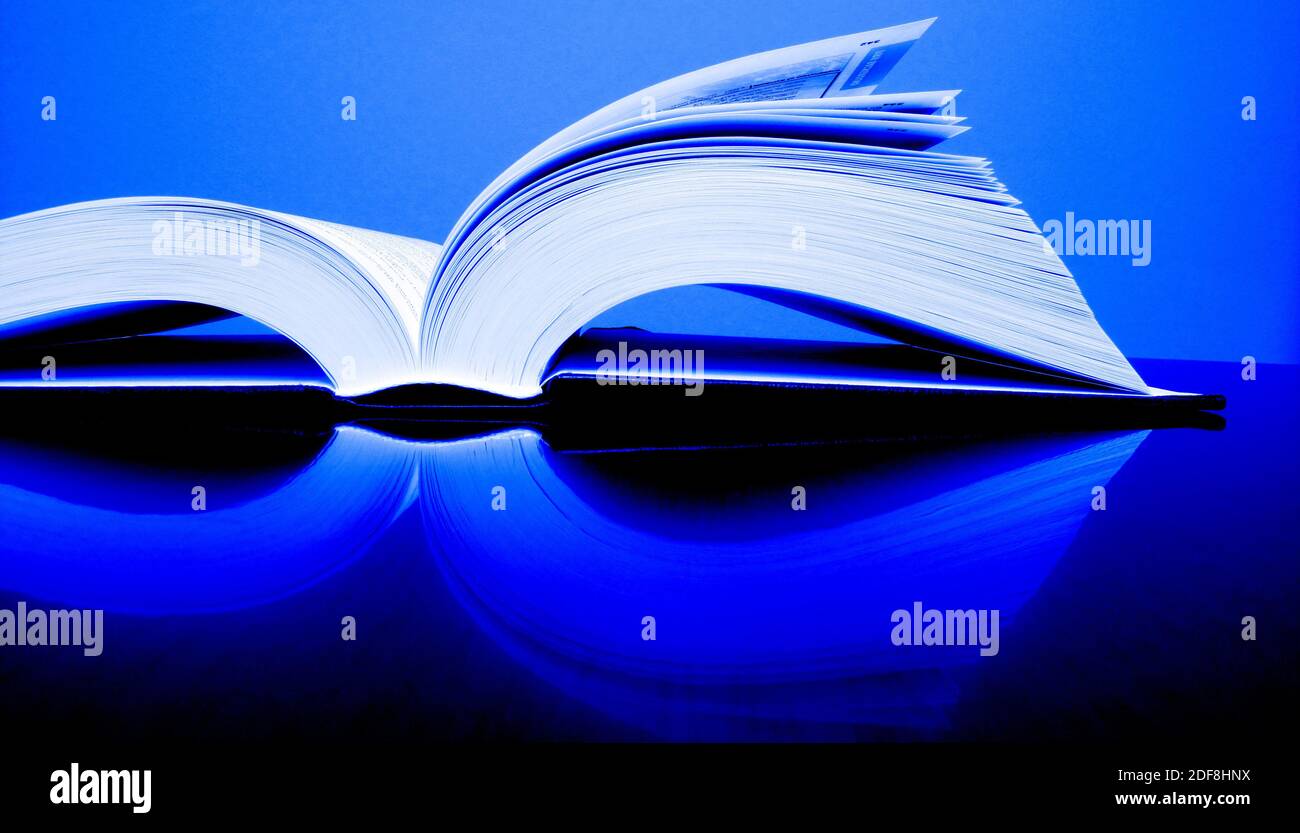 Books open on desk top table for reading or studying Stock Photo