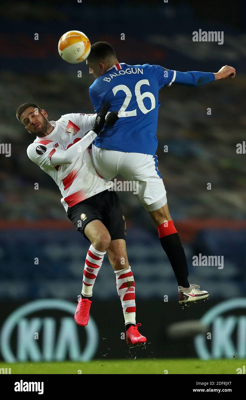 Standard Liege's Duje Cop (left) and Rangers' Leon Balogun battle for the ball during the UEFA Europa League Group D match at Ibrox Stadium, Glasgow. Stock Photo
