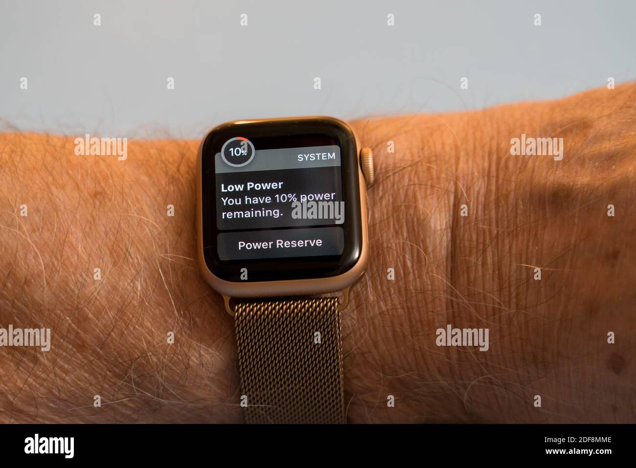 Morgantown, WV - 3 December 2020: Apple watch series six showing system alert about low power warning due to short battery life Stock Photo