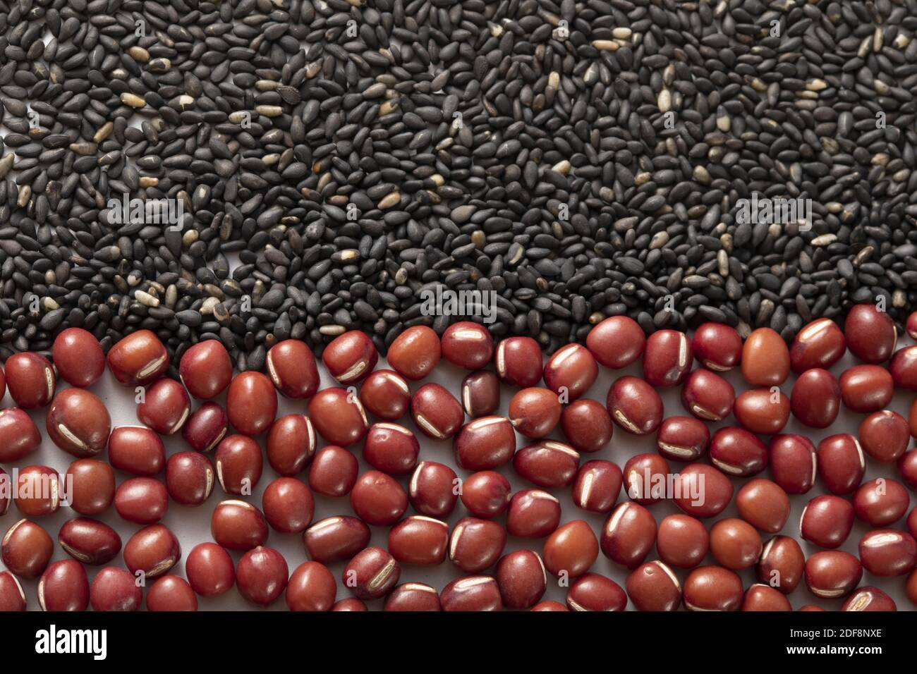 A top view of split black sesame seed and small red bean piles Stock