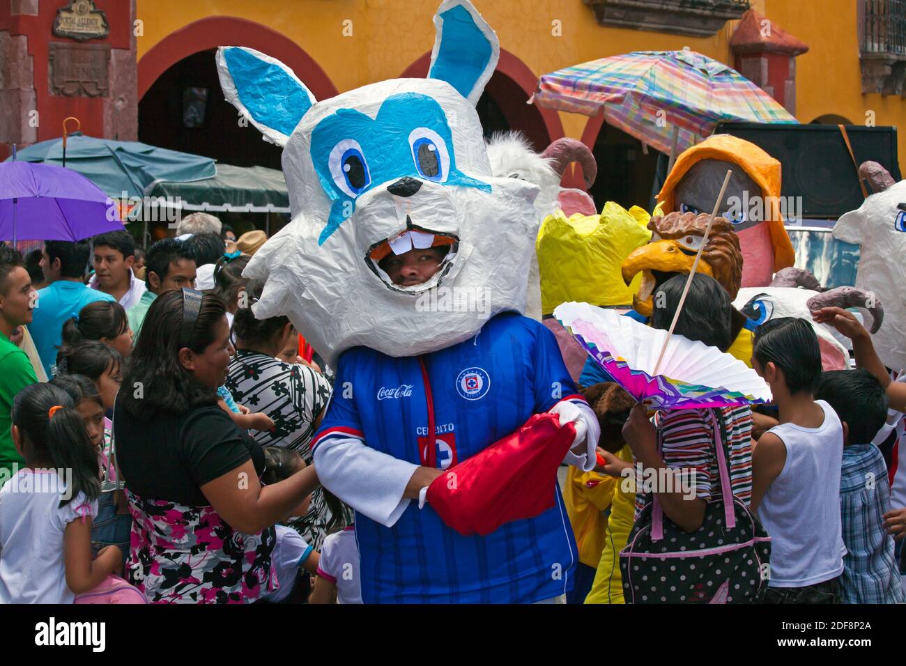 Mexicans dress in costumes and participate the DIA DE LOS LOCOS (DAY OF THE CRAZIES) PARADE - SAN MIGUEL DE ALLENDE,  GUANAJUATO, MEXICO Stock Photo
