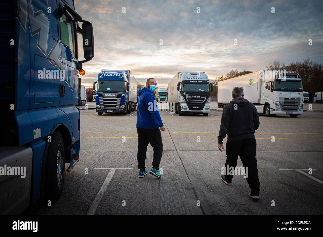 GREAT BRITAIN / KENT /Maidstone  /Two HGV driver from Spain delivering  vegetable from Spain at Channel Ports  Truck stop . Commercial lorry parking . Stock Photo