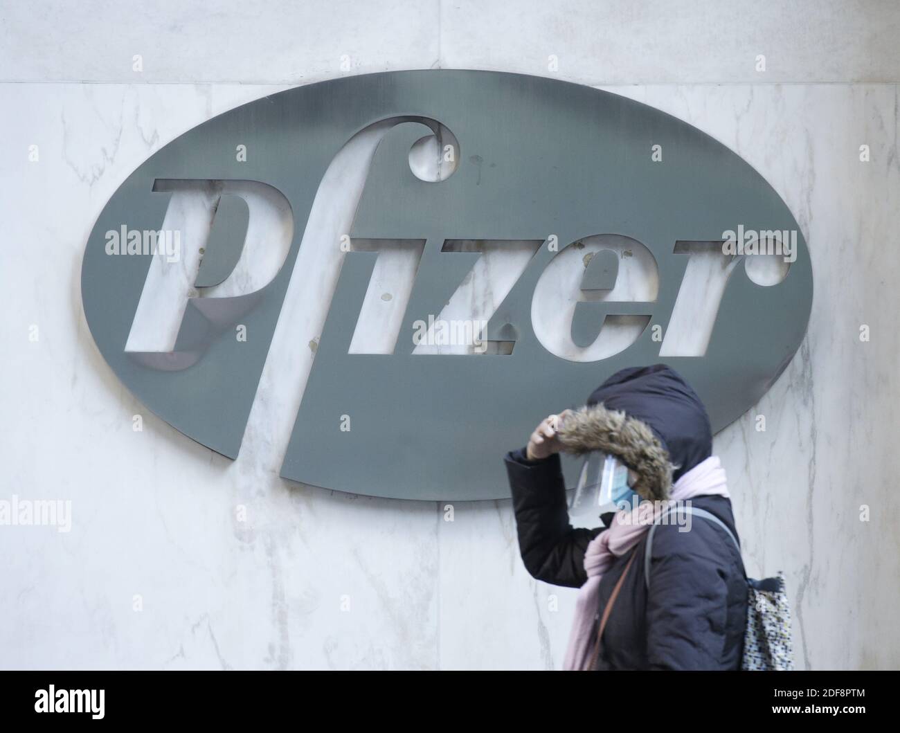 New York, United States. 03rd Dec, 2020. Pedestrians walk by the Pfizer corporate headquarters in New York City on Thursday, December 3, 2020. Pfizer Inc. expects to ship only half of the COVID-19 vaccines it originally planned for this year due to supply-chain problems. Photo by John Angelillo/UPI Credit: UPI/Alamy Live News Stock Photo