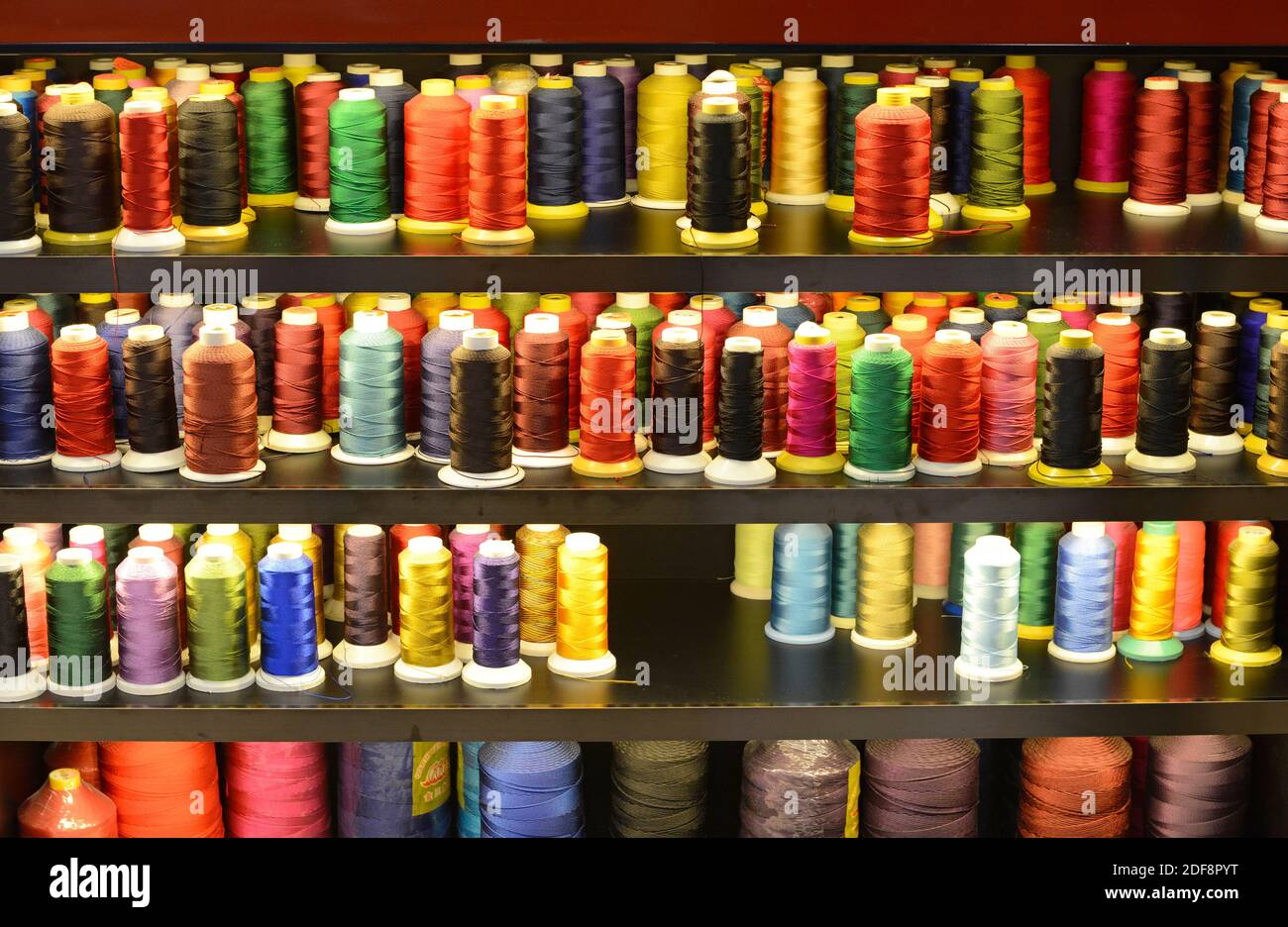 Red and white coloured threads hi-res stock photography and images - Alamy