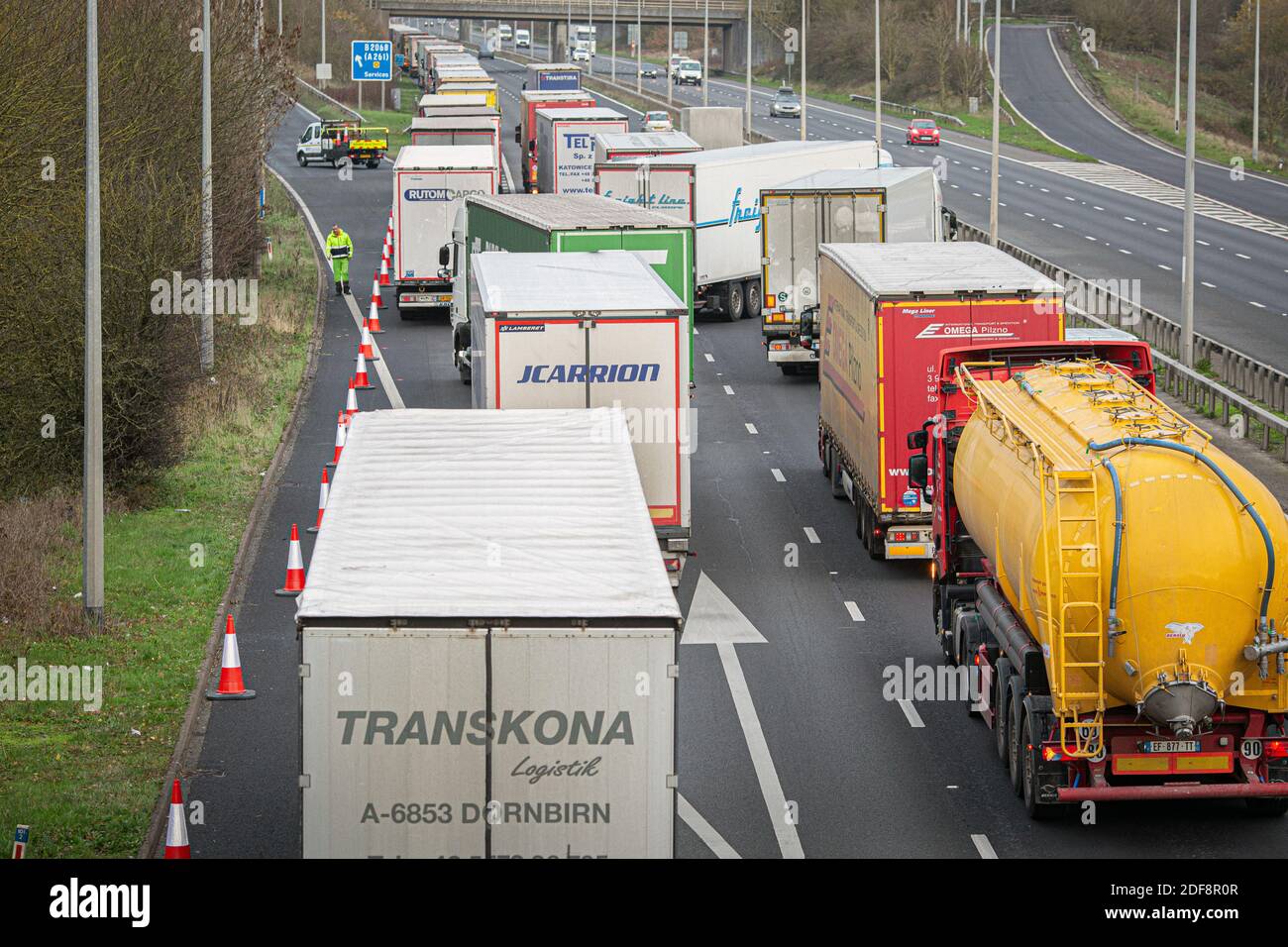 Lorries backlog authorities testing post-Brexit checks at the junction 11 on the M20 as they tried to approach the Eurotunnel. Stock Photo