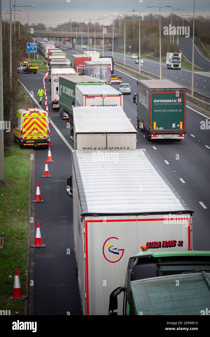 Lorries backlog caused authorities testing post-Brexit checks at the  junction 11 on the M20 as they tried to approach the Eurotunnel . Stock Photo