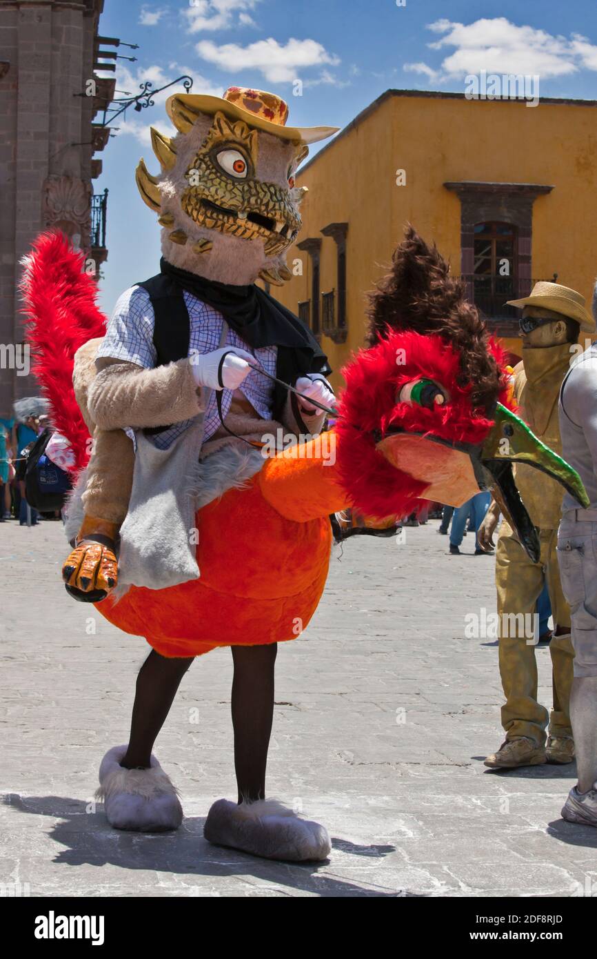 Mexicans dress in costumes and participate the DIA DE LOS LOCOS (DAY OF THE CRAZIES) PARADE - SAN MIGUEL DE ALLENDE,  GUANAJUATO, MEXICO Stock Photo