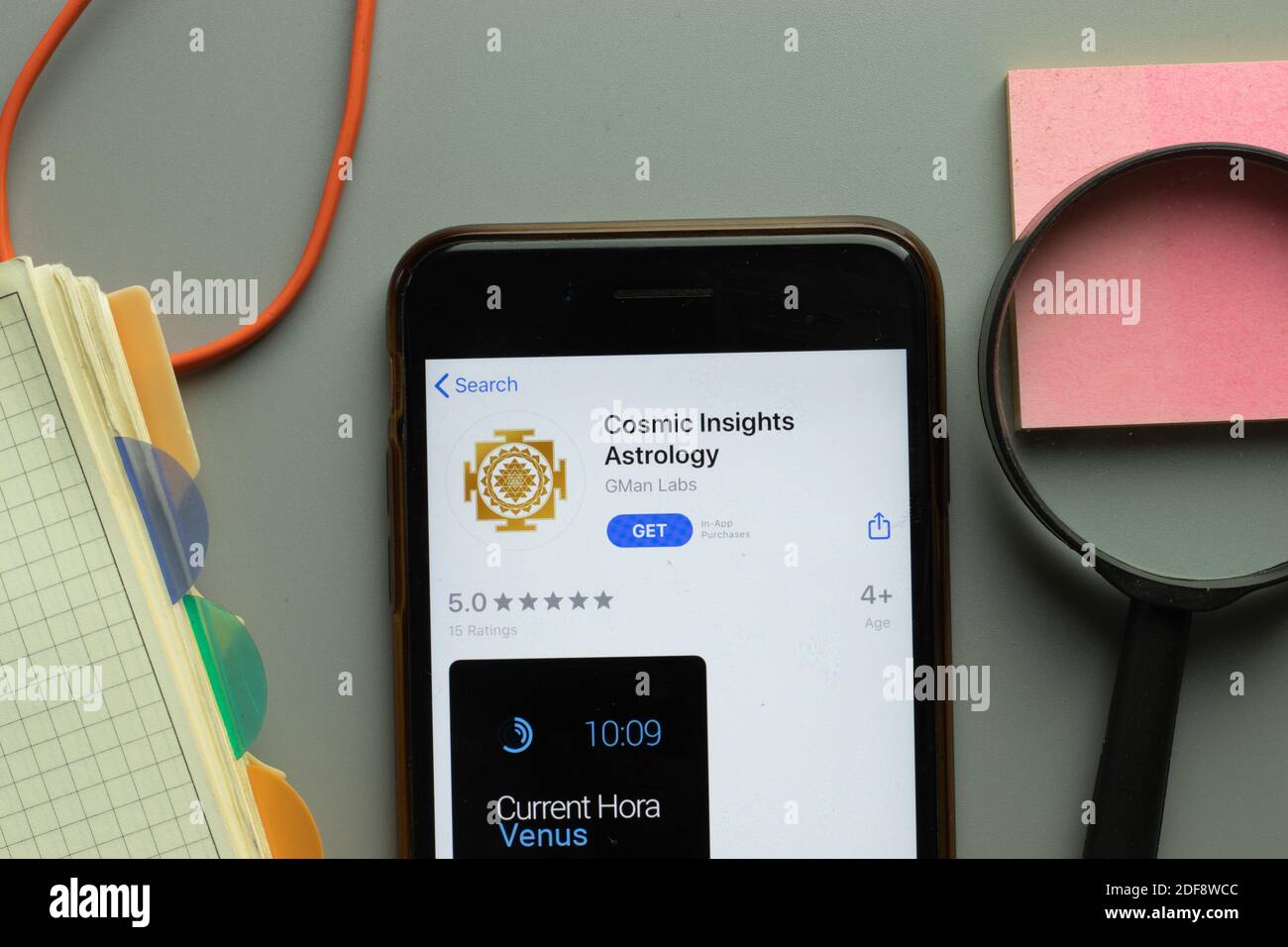 New York, USA - 1 December 2020: Cosmic Insights Astrology mobile app icon on phone screen top view, Illustrative Editorial. Stock Photo