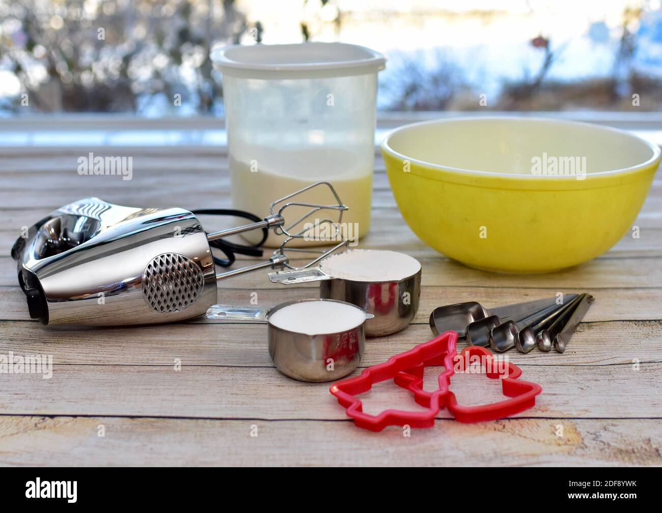 Holiday cookie kitchen utensils and bowls ready for seasonal baking