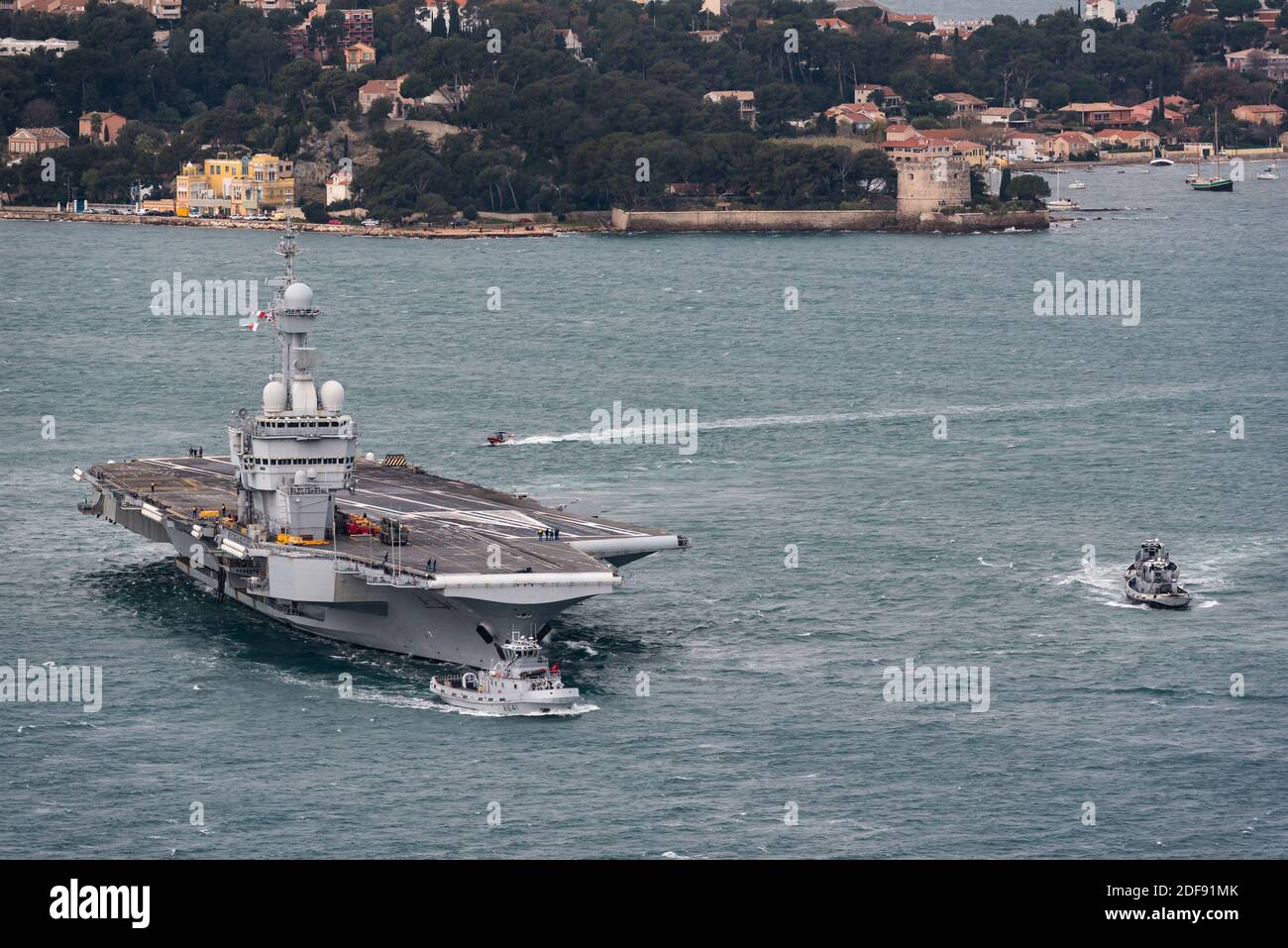 Hand out file photo dated January 21, 2020 of French nuclear aircraft carrier sets sail from Toulon naval base for a several months mission to the eastern Mediterranean to fight terrorism. France’s flagship military aircraft carrier the Charles de Gaulle is on its way back to port after some staff on board showed signs of Covid-19 symptoms, said the French armed forces ministry on Wednesday. The ministry said around 40 staff were under strict medical observation at present. The disclosure comes after a coronavirus outbreak hit the US aircraft carrier Theodore Roosevelt, now at port in Guam. Ph Stock Photo