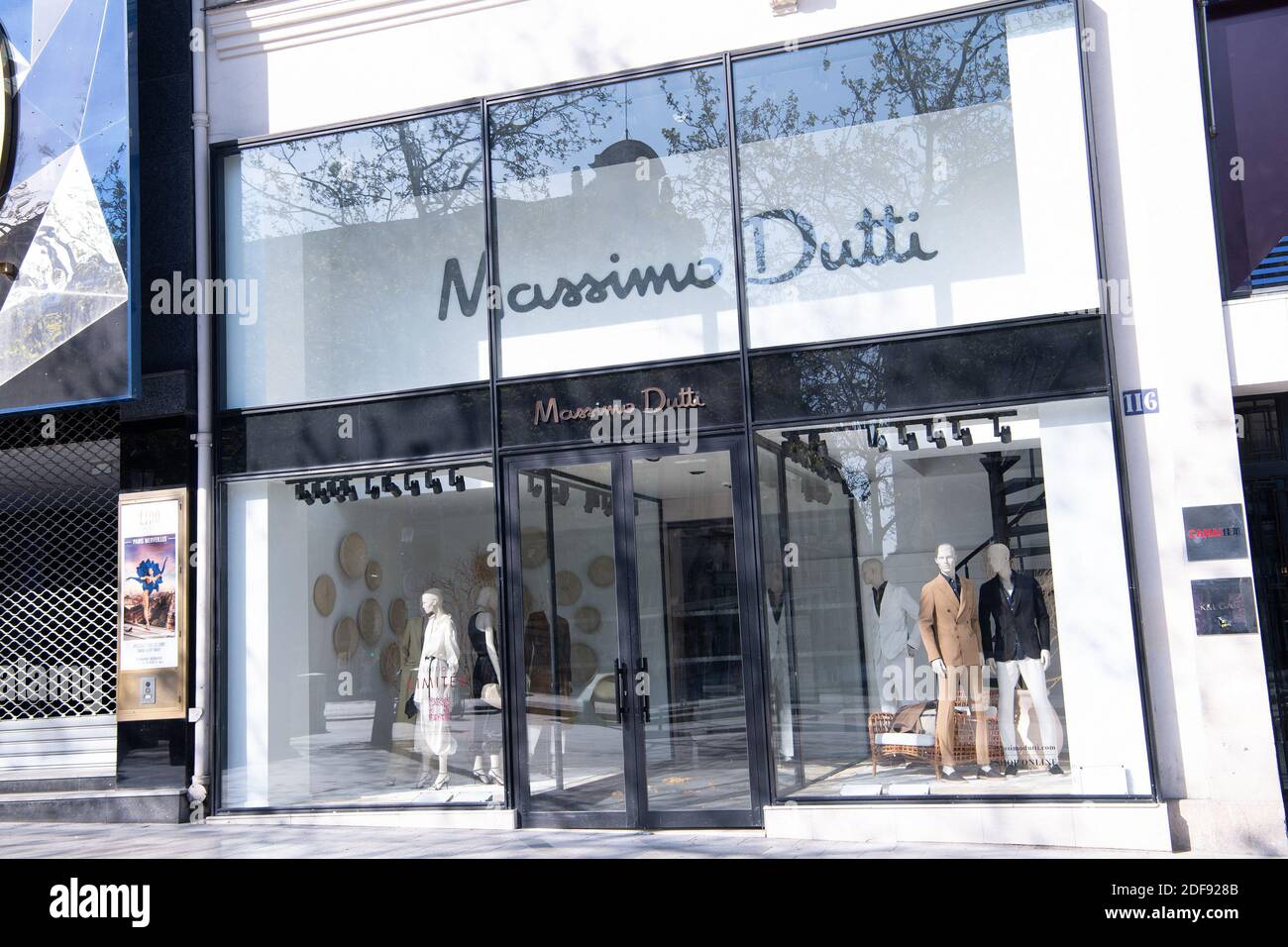 View of a closed Massimo Dutti store on the Champs-Elysees Avenue after  gourvernement measure due to the coronavirus (Covid-19) pandemic in Paris,  on April 8, 2020 in Paris, France. France recorded another