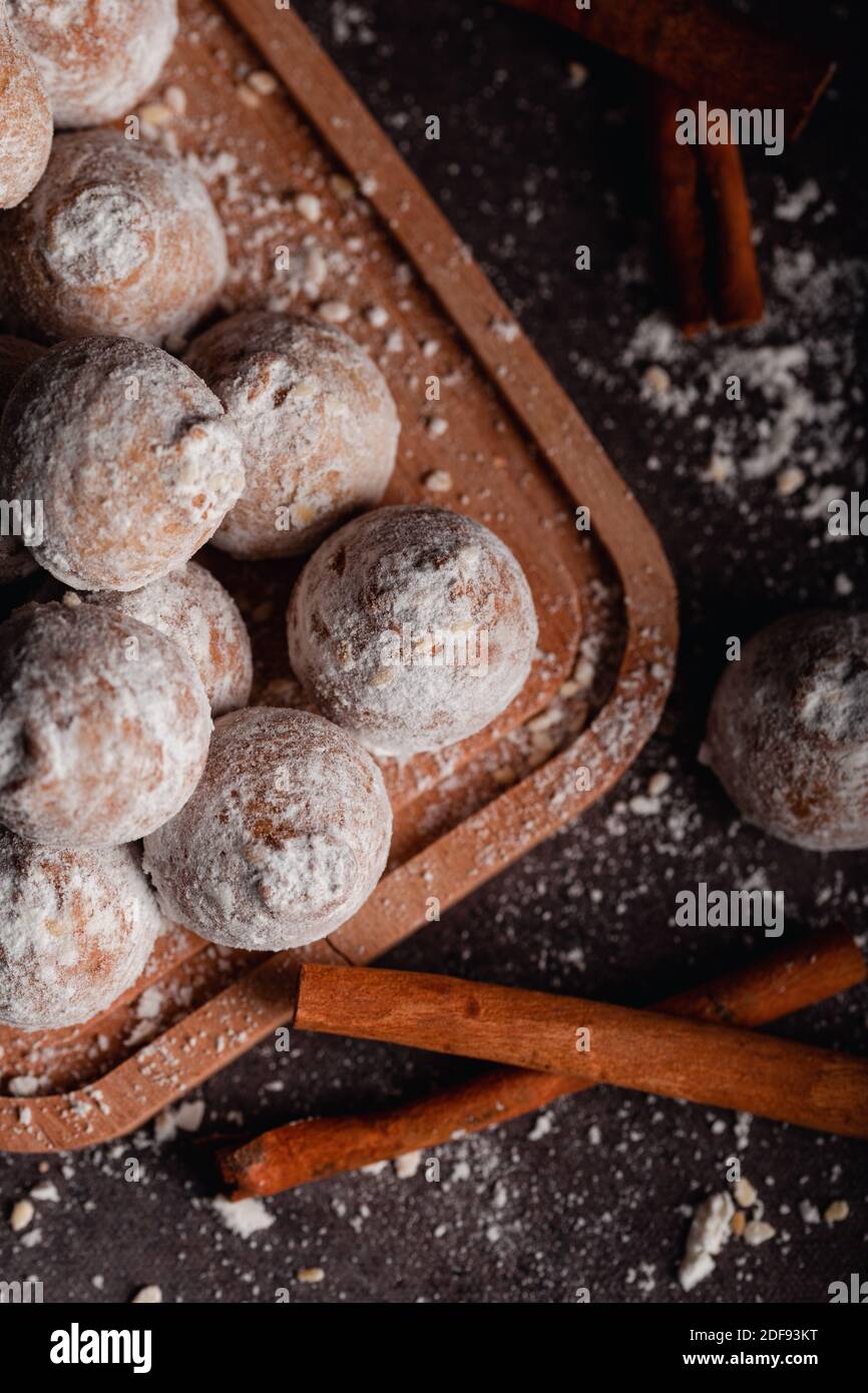 Cinnamon cookies with sugar powder on wood background. Stock Photo