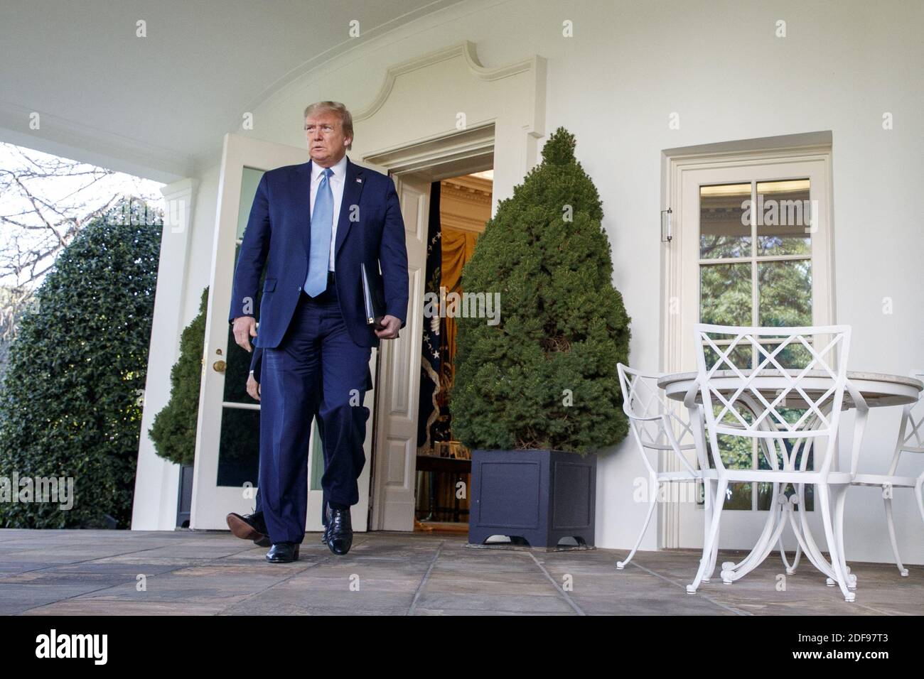 US President Donald J. Trump walks out of the Oval Office to the ...