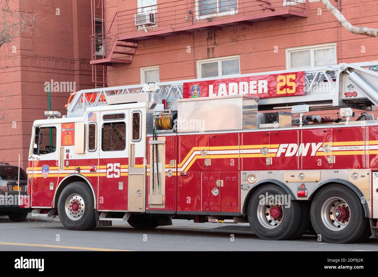 Fire Department of New York ladder truck parked on a new york city street at midday, side reads ladder 25 Stock Photo