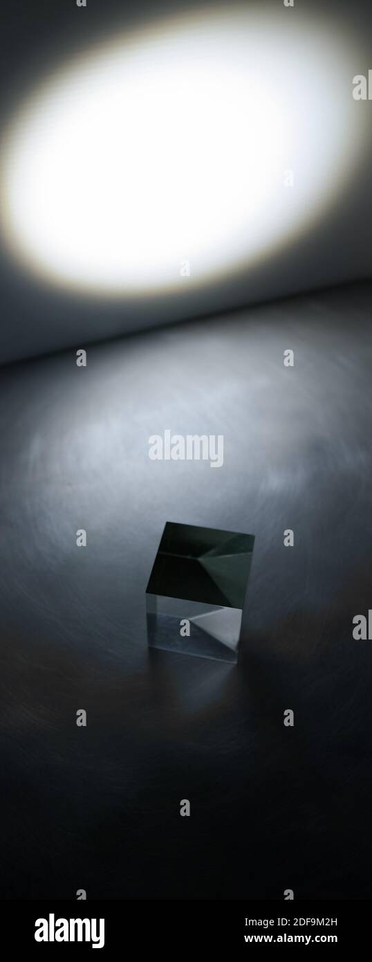 An artistic view of a block of glass and a beam of light. Vertical narrow.. Stock Photo