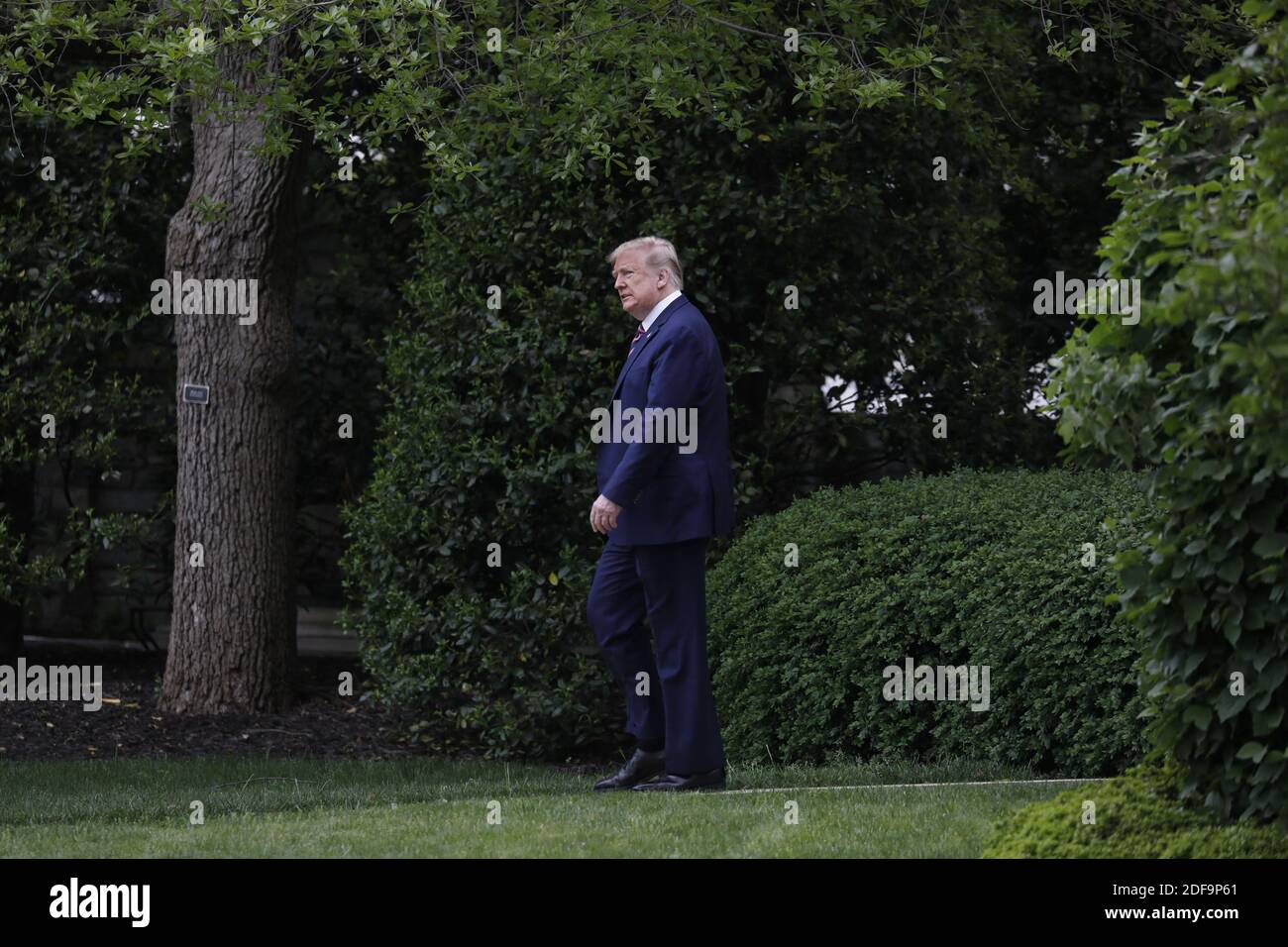 U.S. President Donald Trump walks from the Oval Office of the White ...