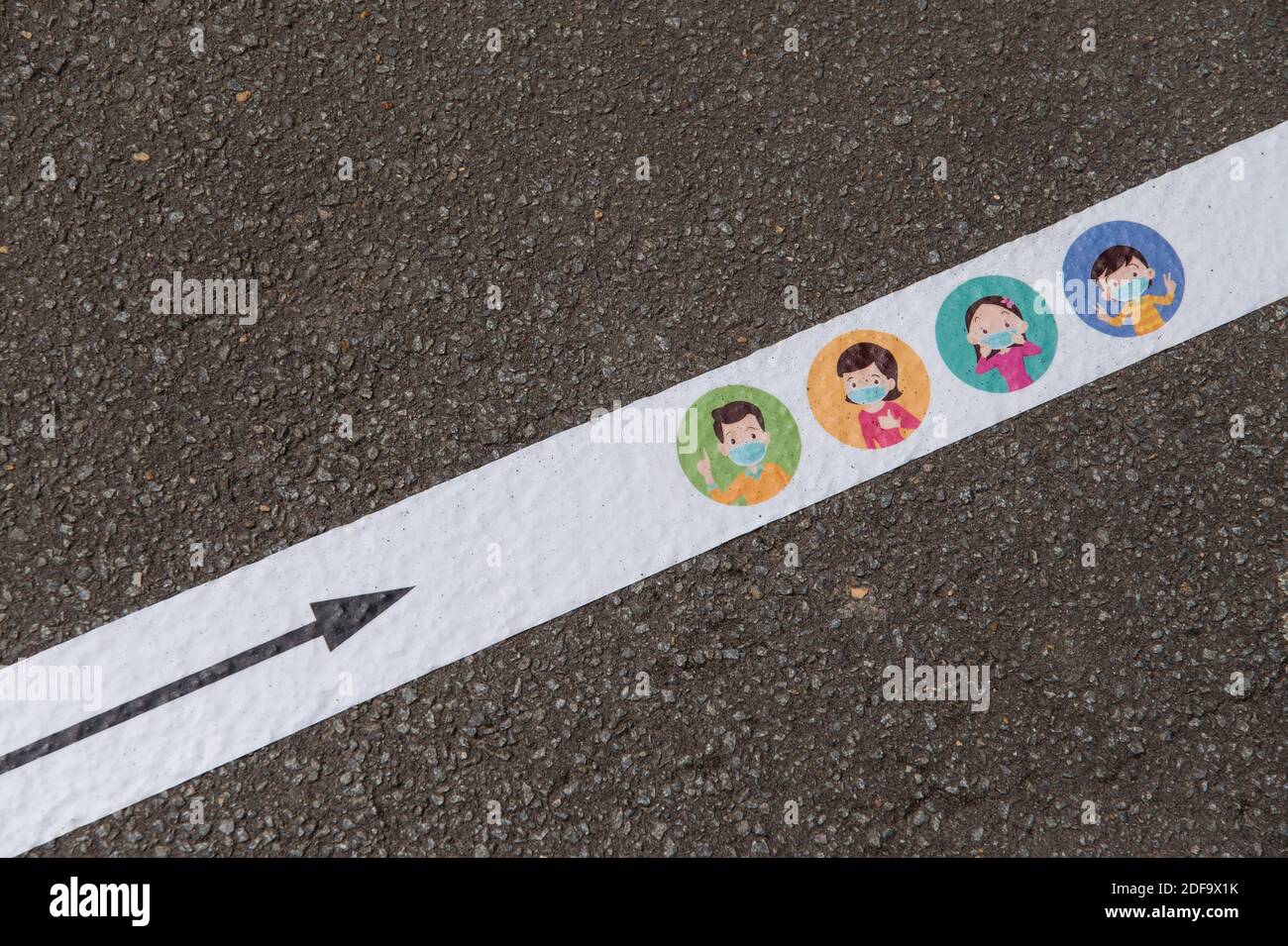 A marking is pictured as people install markings on the ground to 