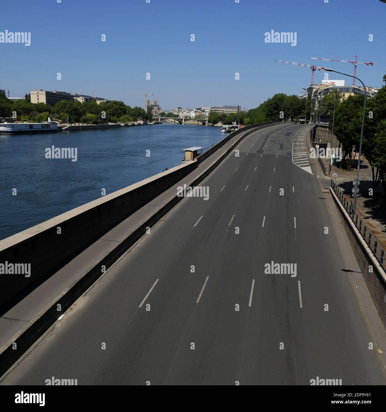 Deserted Quai de Bercy road on the Right Bank of the River Seine in Paris, France, along the stretch close to where the Palais du Louvre and the Quai François Mitterrand, in Paris, as a strict lockdown comes into in effect in France to stop the spread of COVID-19. after the announcement by French President Emmanuel Macron of the strict home confinement rules of the French due to an outbreak of coronavirus pandemic (COVID-19) on March 18, 2020 in Paris, France. the French will have to stay at home, France has closed down all schools, theatres, cinemas and a range of shops, with only those selli Stock Photo