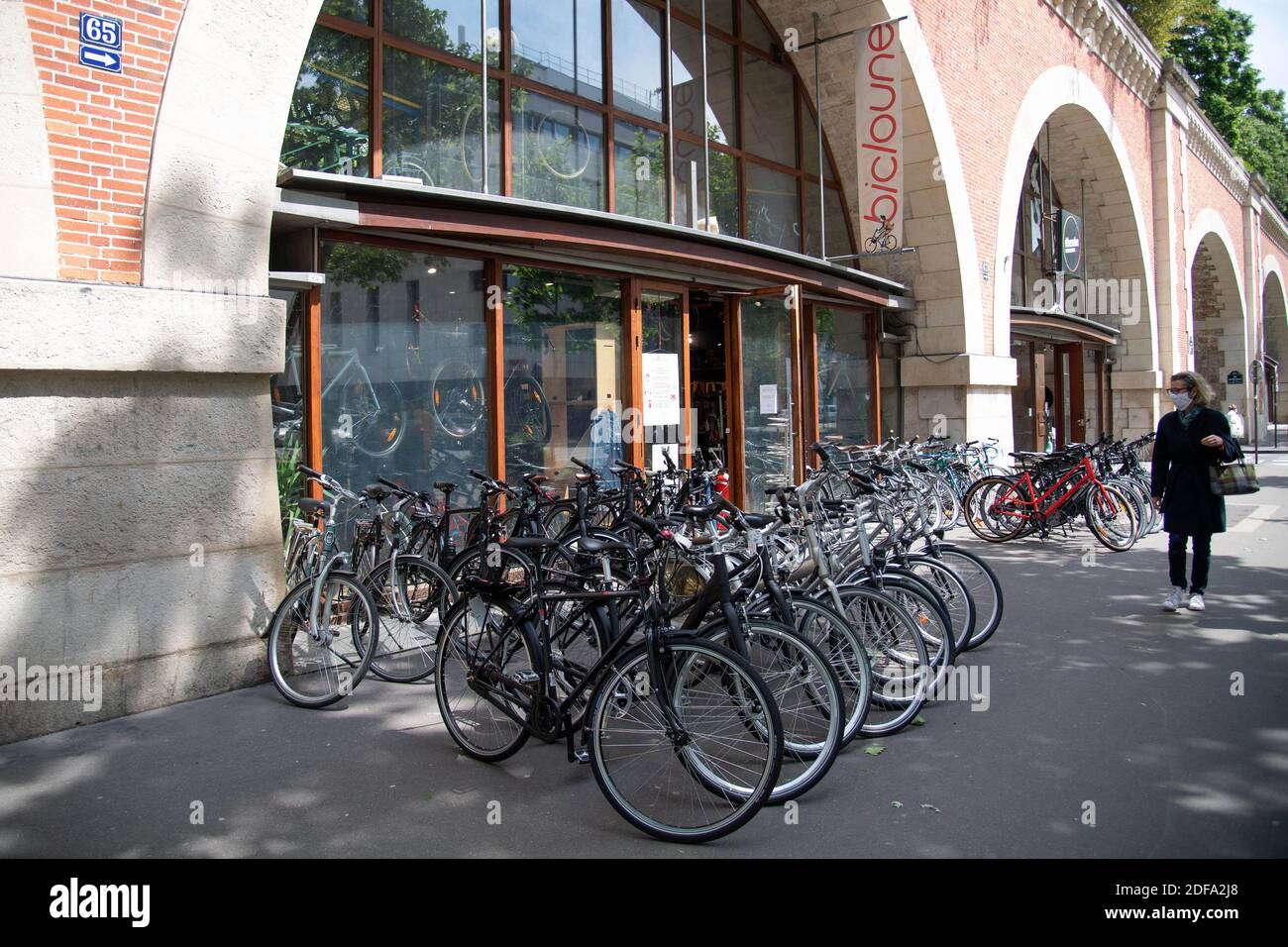 Clients and staff members are seen at the Bicloune bicycle shop in Paris France on May 13 2020. As the French capital emerges from 55 days of lockdown and slowly moves towards