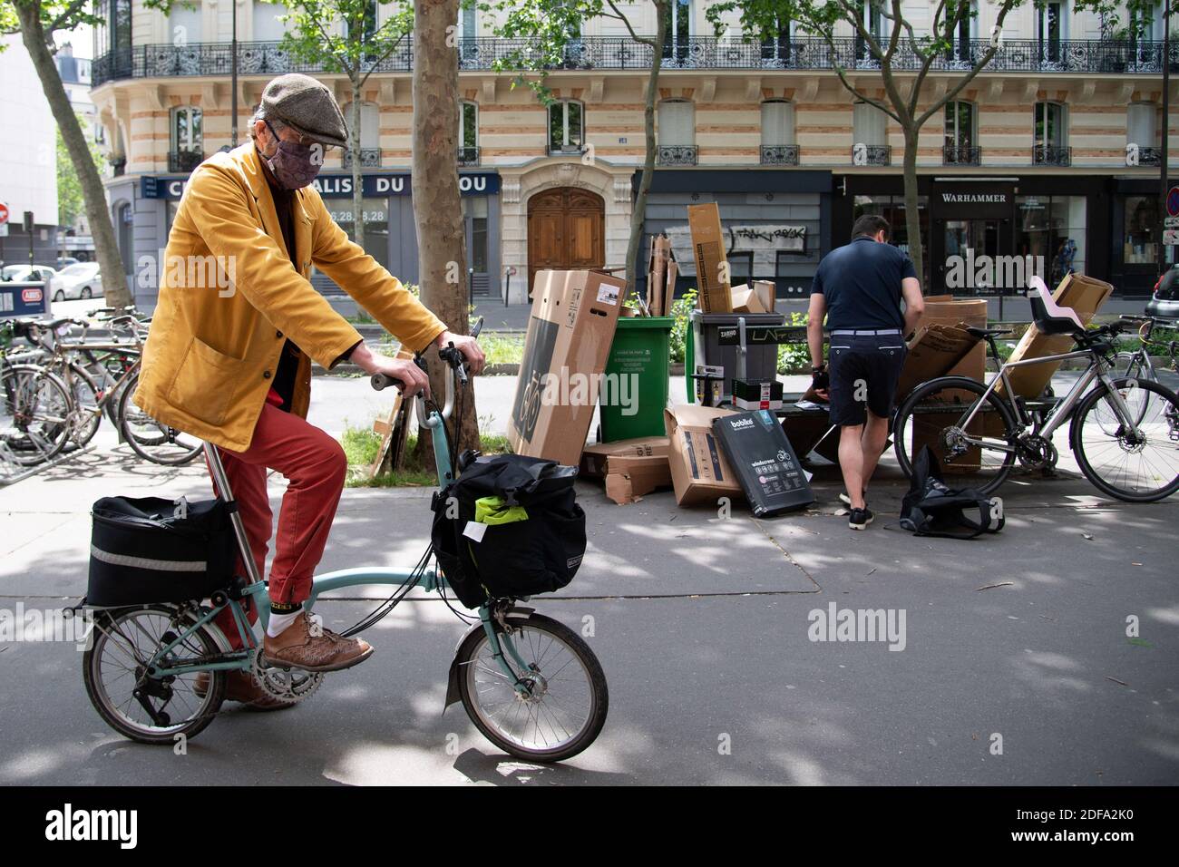 Portrait of the shop owner on a bicycle at the Bicloune bicycle shop in  Paris, France on May 13, 2020. As the French capital emerges from 55 days  of lockdown and slowly
