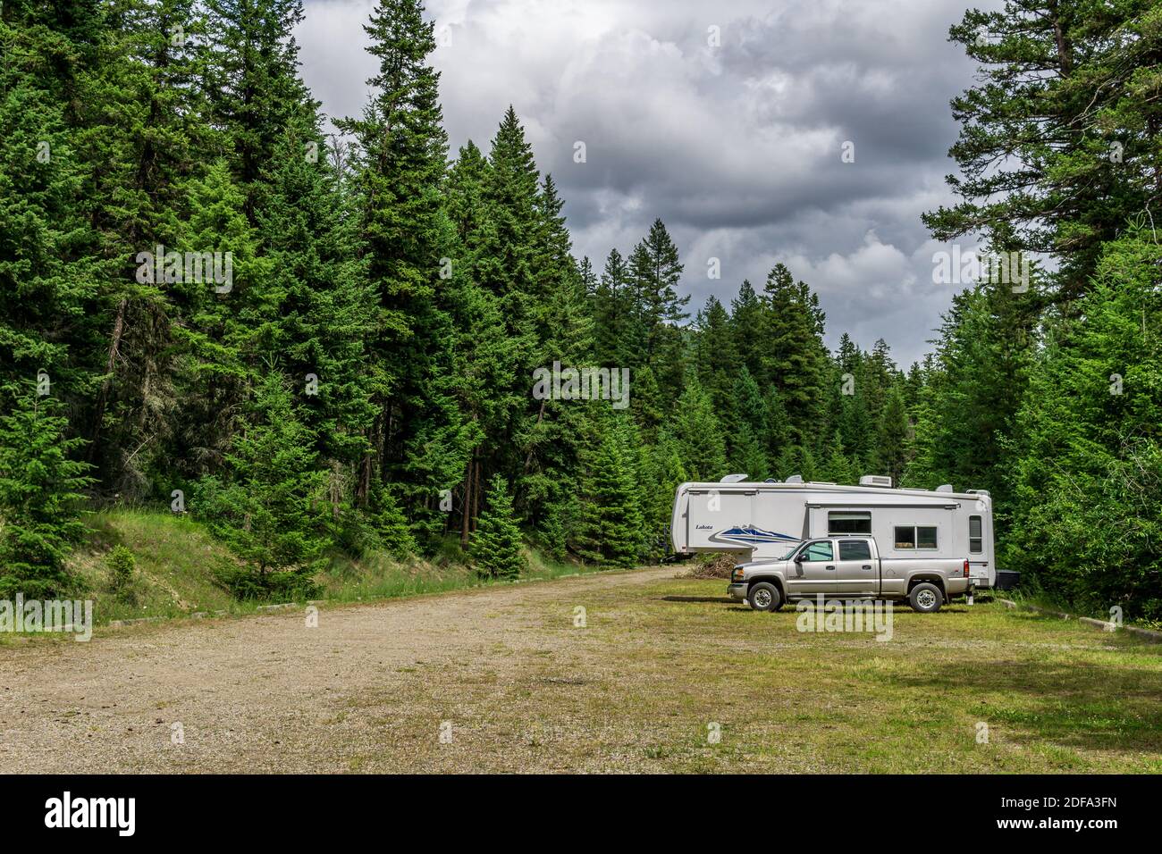 KAMLOOPS, CANADA - JULY 9, 2020: Classic Travel Trailer and truck at camping site Paul Lake Stock Photo