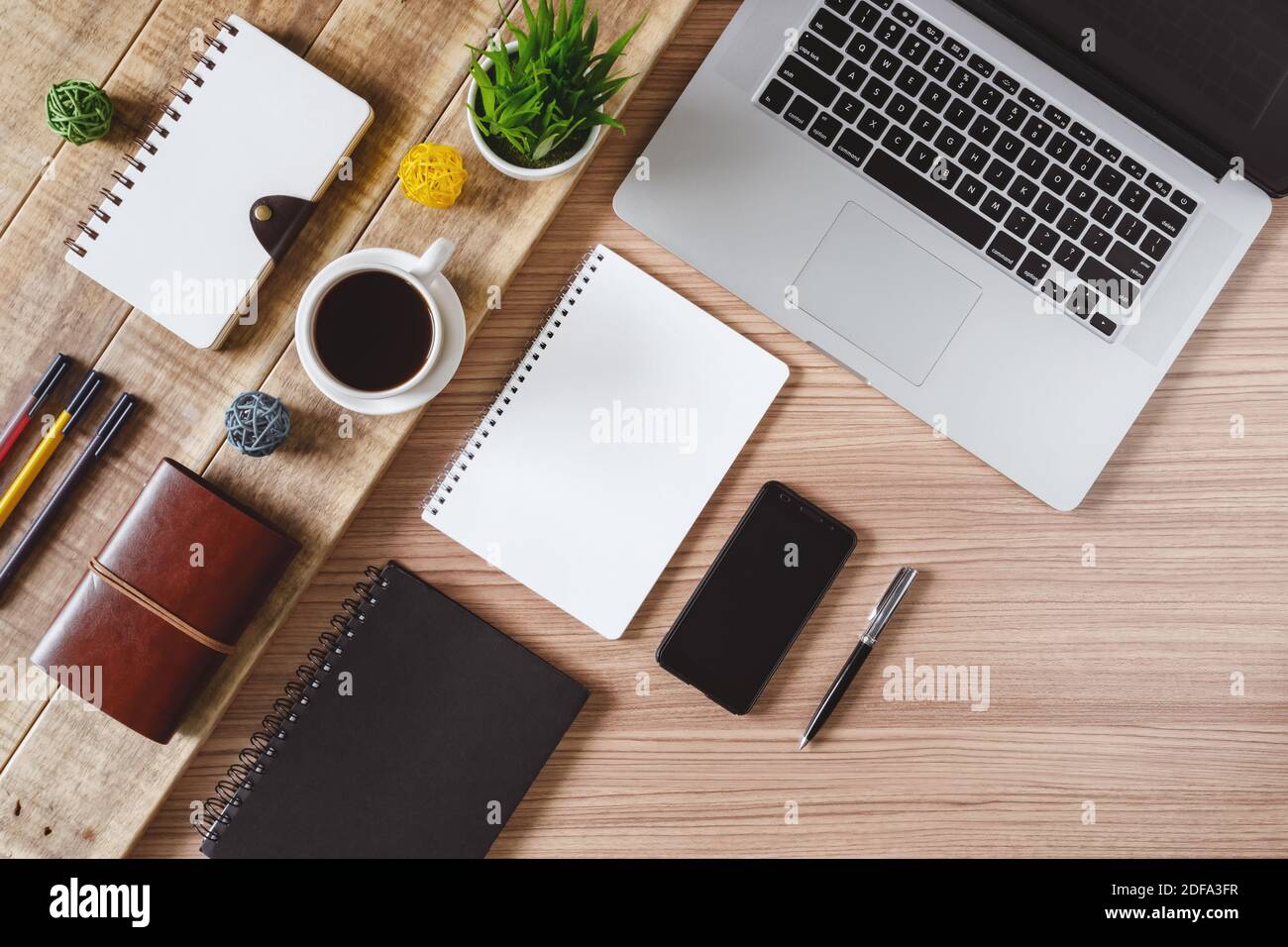 Office supply items, laptop and coffee on rustic wood. Rustic office ...