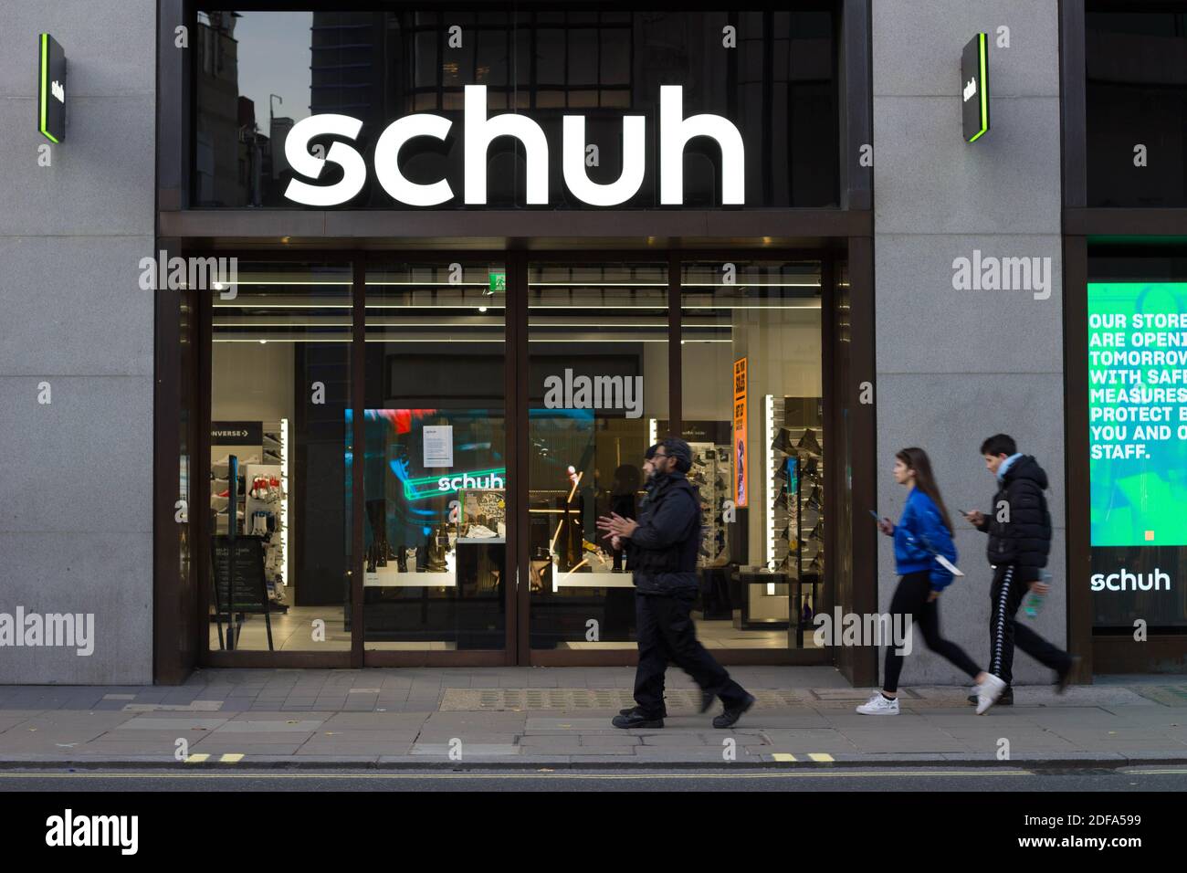 Shoppers walked outside schuh store on Oxford street London Stock Photo -  Alamy