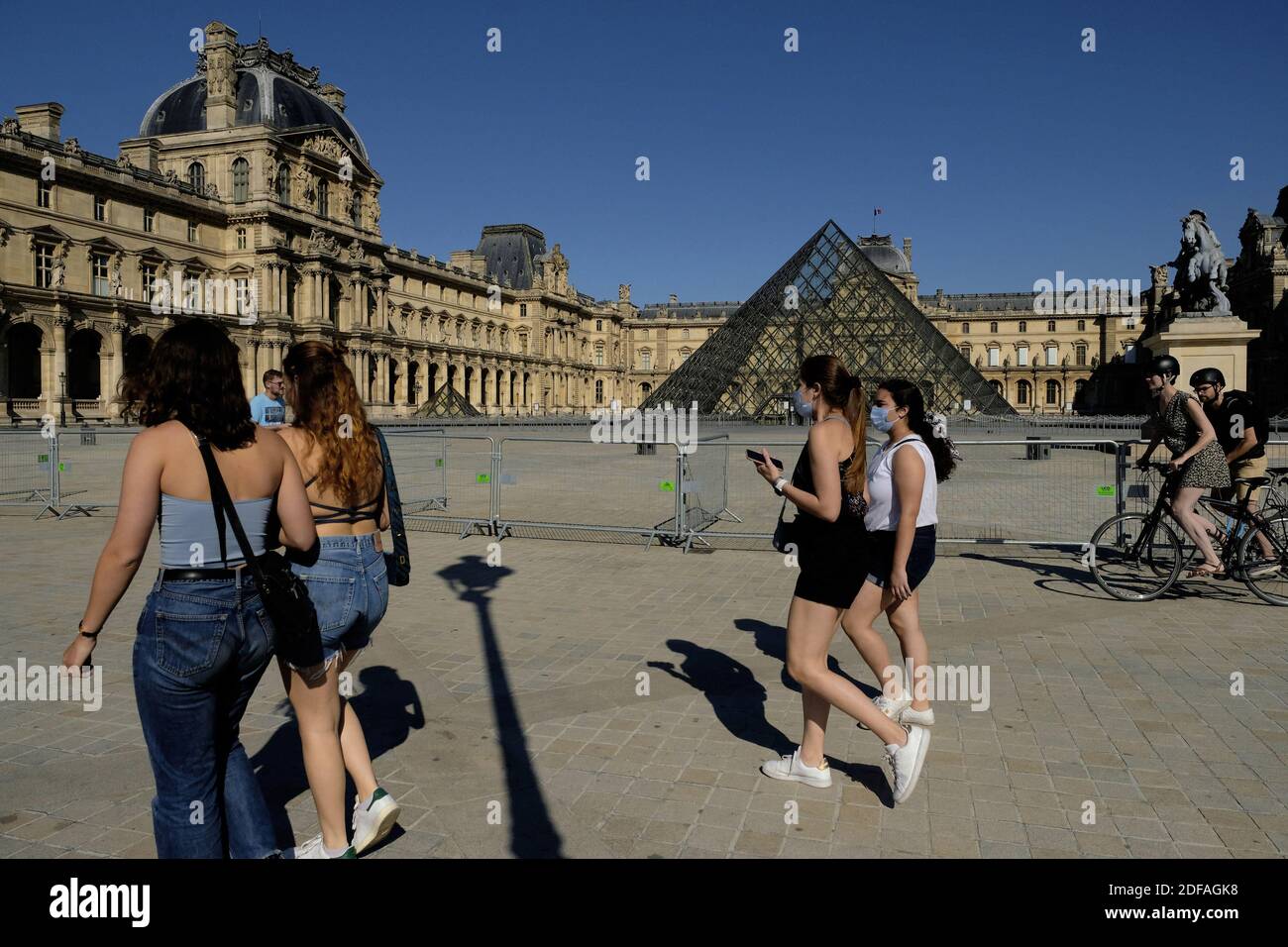 The Louvre Pyramids (Pyramides du Louvre) a large glass and metal pyramid, louvre museum (musee du louvre) is still closed as parks and gardens of Paris are reopening. on the first day of its reopening, as France eases lockdown measures taken to curb the spread of the COVID-19 (the novel coronavirus). Parks and gardens reopen on on May 30, 2020 in France, cafes and restaurants are preparing to welcome their first customers on June 2, since mid-March: a scent of rediscovered freedom floats in the air, despite still limited travel and a grim economic landscape. Paris, France on May 30, 2020. Pho Stock Photo