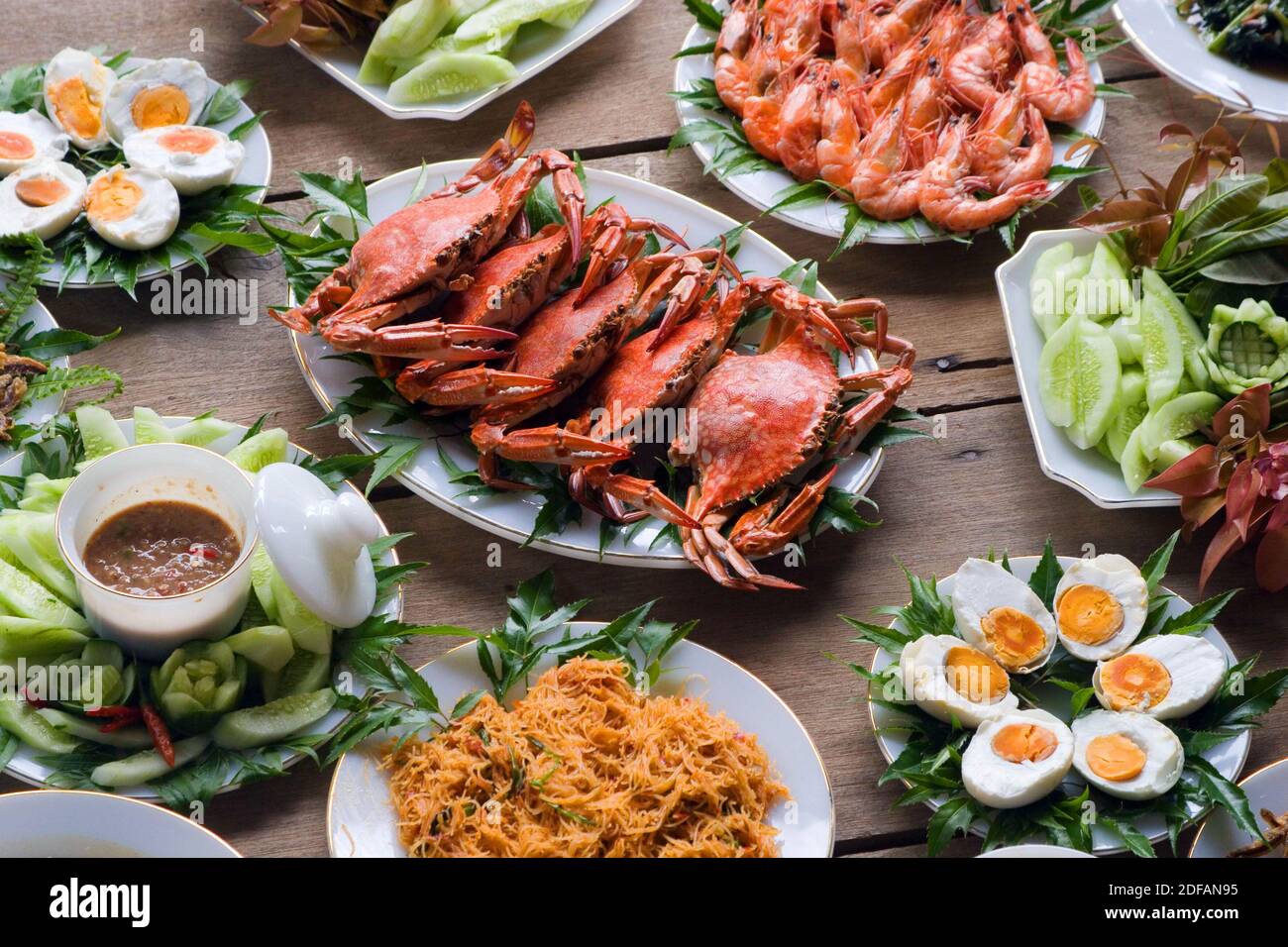 A feast of locally harvested crab, shrimp, wild and domestic vegetable are prepared for visitors in  Tung Nang Dam located on the North Andaman Sea - Stock Photo