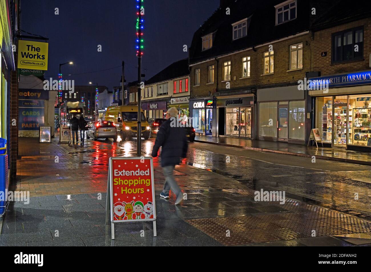 Night time in the High Street looking south towards Halls Corner, Wickford, Essex. UK.   Christmas lights. Stock Photo