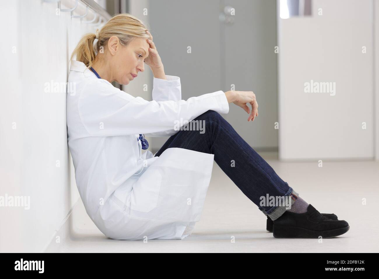 Tired middle aged female doctor hi-res stock photography and images - Alamy