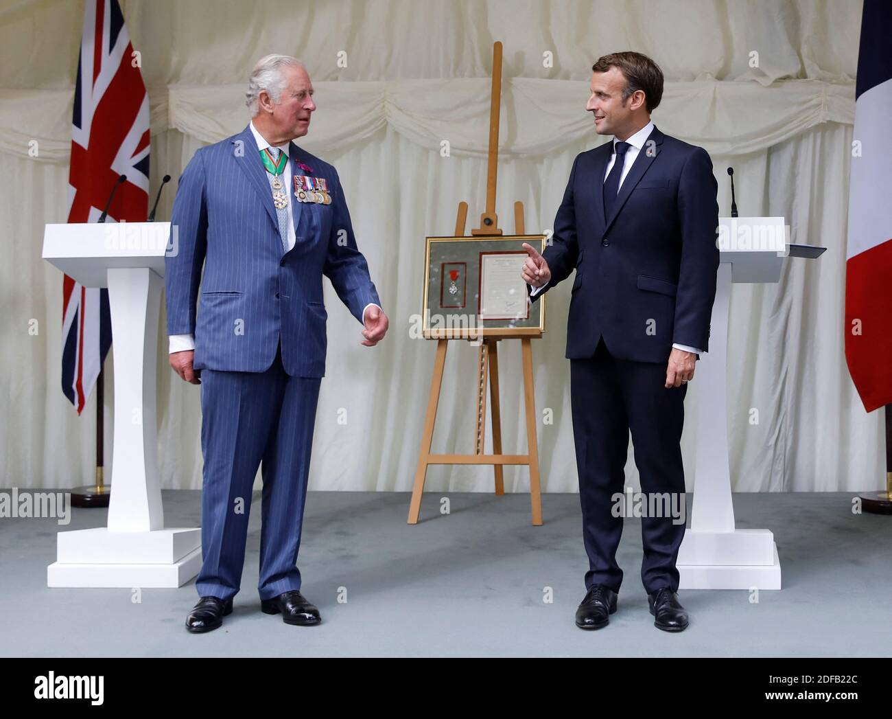 Britain's Prince Charles, Prince of Wales (L) and French President Emmanuel Macron (R) speaks after a ceremony to present the Legion d'Honneur – France's highest distinction – to London for services during WW2 at Carlton Gardens in central London on June 18, 2020 during a visit to mark the anniversary of former de Gaulle's appeal to French people to resist the Nazi occupation. - Macron visited London on June 18 to commemorate the 80th anniversary of former French president Charles de Gaulle's appeal to French people to resist the Nazi occupation during World War II. Photo by Tolga AKMEN/Pool/A Stock Photo