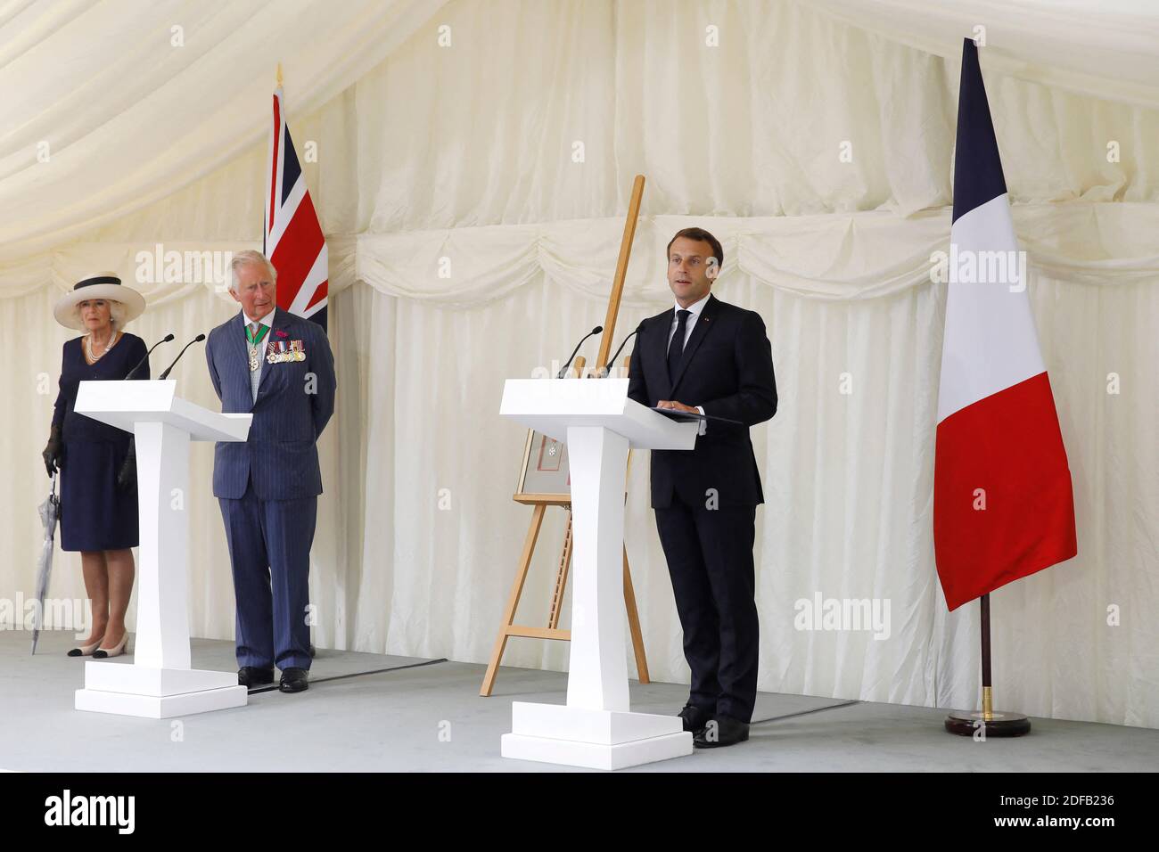 French President Emmanuel Macron (R) speaks at a wreath-laying event at Carlton Gardens in central London on June 18, 2020 with Britain's Prince Charles, Prince of Wales (2L) and Britain's Camilla, Duchess of Cornwall (L) during a visit to mark the anniversary of French president Charles de Gaulle's appeal to French people to resist the Nazi occupation during WWII. - Macron visited London on June 18 to commemorate the 80th anniversary of former French president Charles de Gaulle's appeal to French people to resist the Nazi occupation during World War II. Photo by Tolga AKMEN/Pool/ABACAPRESS.CO Stock Photo