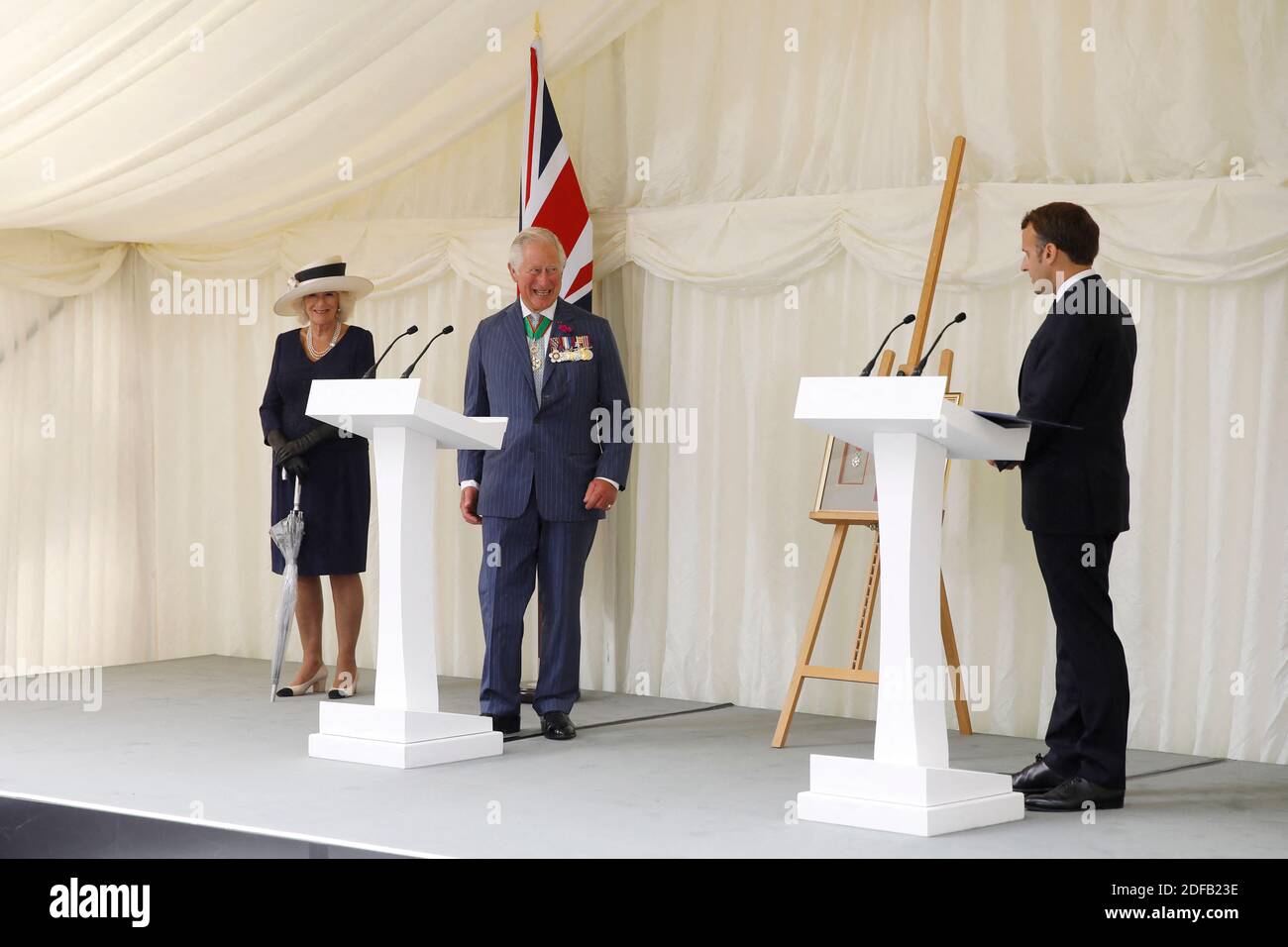 French President Emmanuel Macron (R) speaks at a wreath-laying event at Carlton Gardens in central London on June 18, 2020 with Britain's Prince Charles, Prince of Wales (2L) and Britain's Camilla, Duchess of Cornwall (L) during a visit to mark the anniversary of French president Charles de Gaulle's appeal to French people to resist the Nazi occupation during WWII. - Macron visited London on June 18 to commemorate the 80th anniversary of former French president Charles de Gaulle's appeal to French people to resist the Nazi occupation during World War II. Photo by Tolga AKMEN/Pool/ABACAPRESS.CO Stock Photo