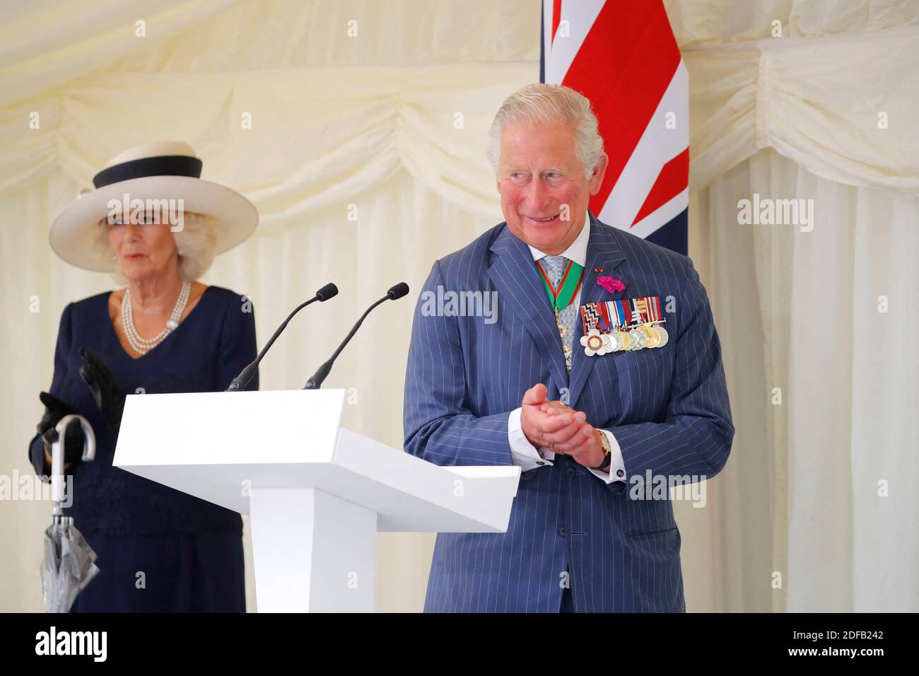 Britain's Camilla, Duchess of Cornwall (L) and Britain's Prince Charles, Prince of Wales (R) attend a ceremony to present the Legion d'Honneur – France's highest distinction – to London for services during WW2 at Carlton Gardens in central London on June 18, 2020 during a visit to mark the anniversary of former de Gaulle's appeal to French people to resist the Nazi occupation. - Macron visited London on June 18 to commemorate the 80th anniversary of former French president Charles de Gaulle's appeal to French people to resist the Nazi occupation during World War II. Photo by Tolga AKMEN/Pool/A Stock Photo