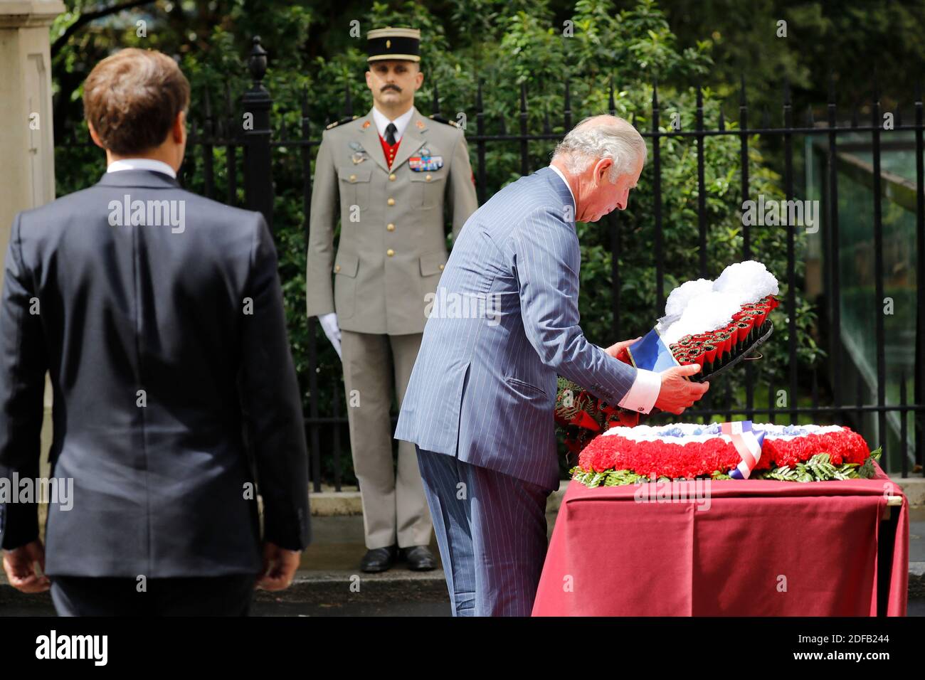 French President Emmanuel Macron (L) looks on as Britain's Prince Charles, Prince of Wales (R) lays a wreath at the statue of former French president Charles de Gaulle at Carlton Gardens in central London on June 18, 2020 during a visit to mark the anniversary of former de Gaulle's appeal to French people to resist the Nazi occupation. - Macron visited London on June 18 to commemorate the 80th anniversary of former French president Charles de Gaulle's appeal to French people to resist the Nazi occupation during World War II. Photo by Tolga AKMEN/Pool/ABACAPRESS.COM Stock Photo