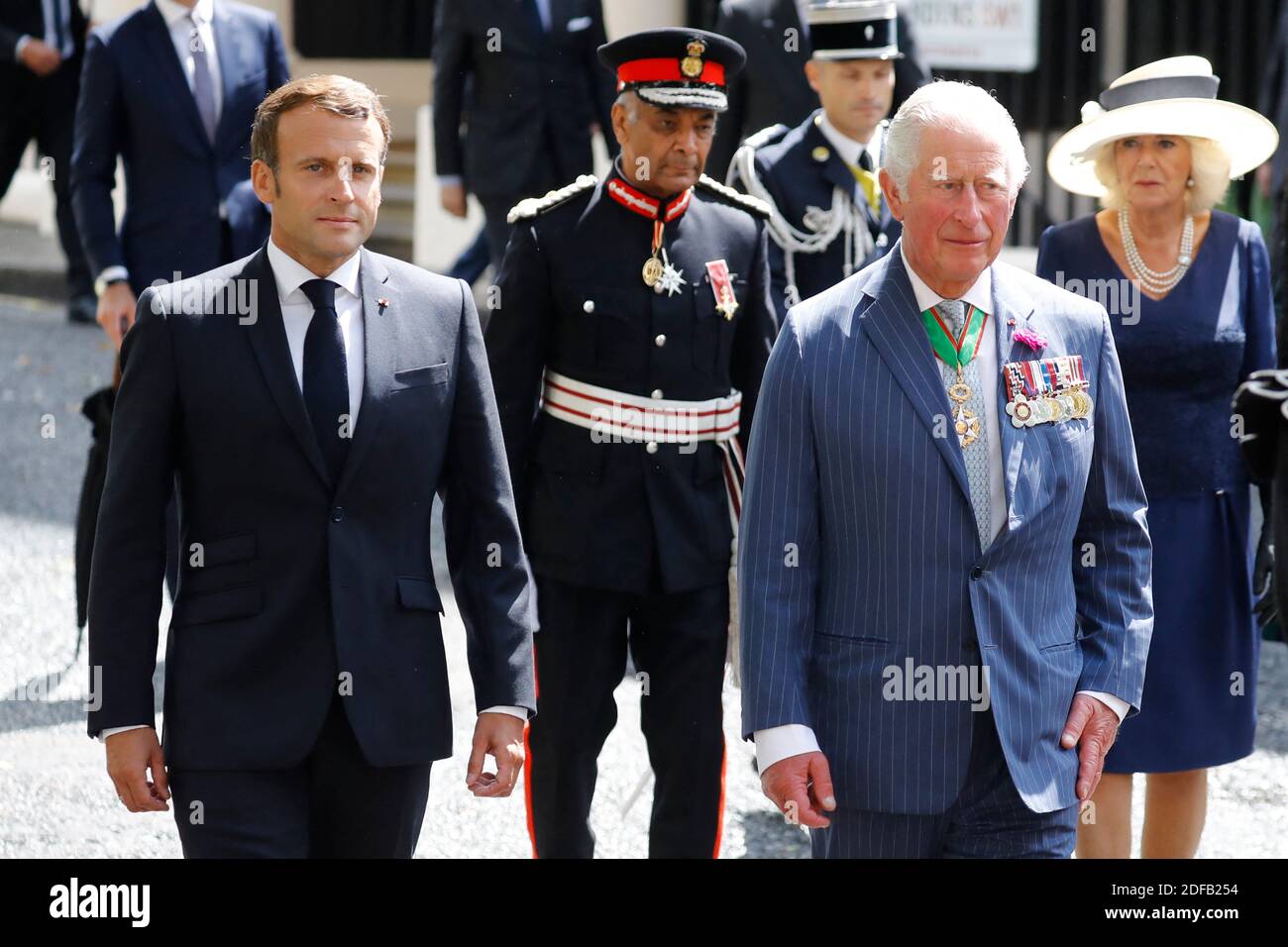 French President Emmanuel Macron (L), The Lord-Lieutenant of Greater London, Sir Kenneth Olisa (2nd L), Britain's Prince Charles, Prince of Wales (2nd R) and Britain's Camilla, Duchess of Cornwall (R) arrive to lay wreaths at the statue of former French president Charles de Gaulle at Carlton Gardens in central London on June 18, 2020 during a visit to mark the anniversary of former de Gaulle's appeal to French people to resist the Nazi occupation. - Macron visited London on June 18 to commemorate the 80th anniversary of former French president Charles de Gaulle's appeal to French people to res Stock Photo