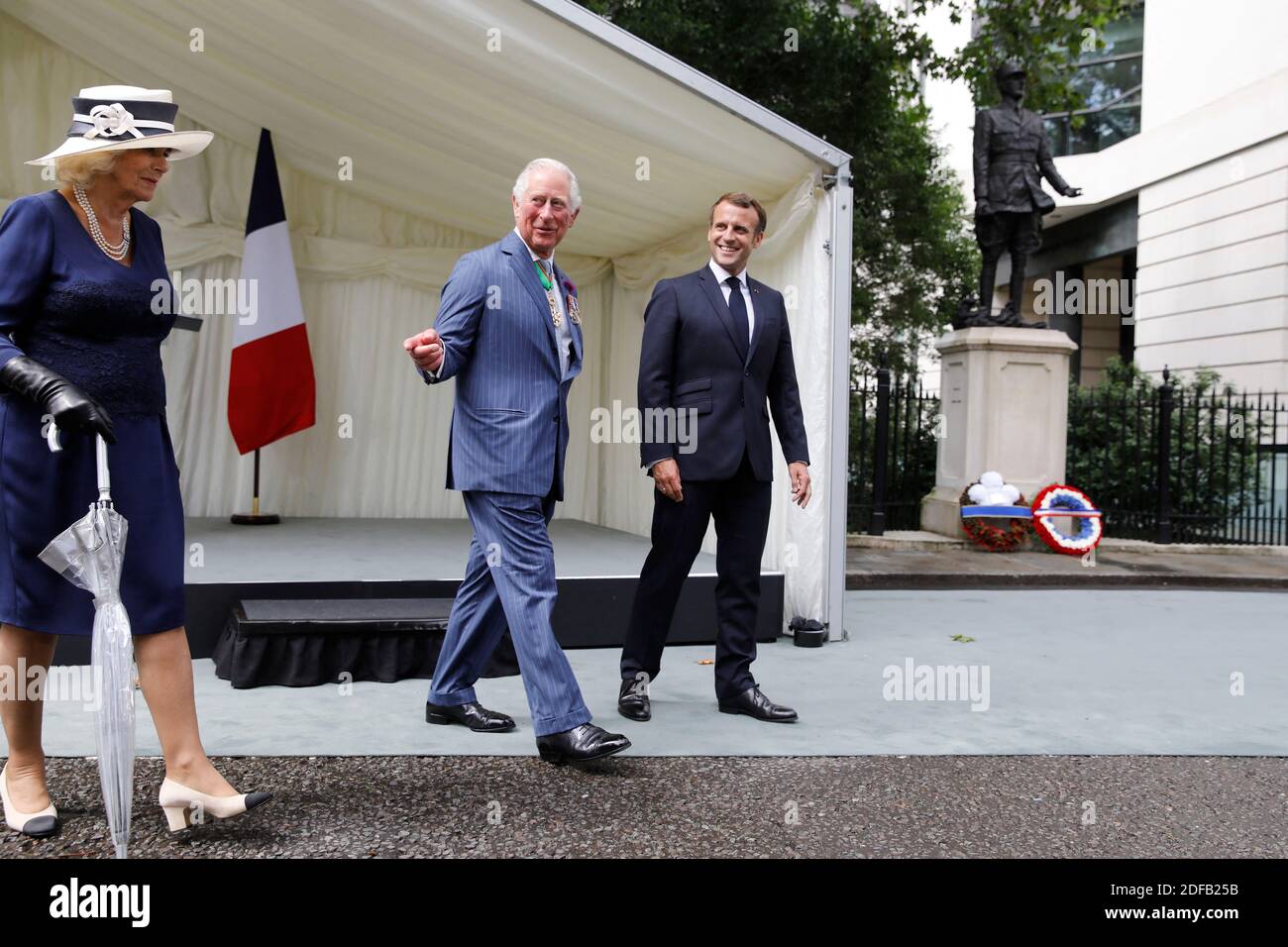 Britain's Camilla, Duchess of Cornwall (L), Britain's Prince Charles, Prince of Wales (C) and French President Emmanuel Macron (R) leaves after a ceremony to lay wreaths at the statue of former French president Charles de Gaulle at Carlton Gardens in central London on June 18, 2020 during a visit to mark the anniversary of former de Gaulle's appeal to French people to resist the Nazi occupation. - Macron visited London on June 18 to commemorate the 80th anniversary of former French president Charles de Gaulle's appeal to French people to resist the Nazi occupation during World War II. Photo by Stock Photo