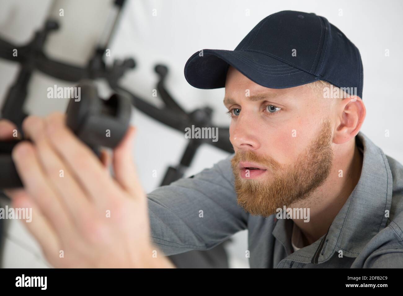 repairing a chair castors Stock Photo Alamy