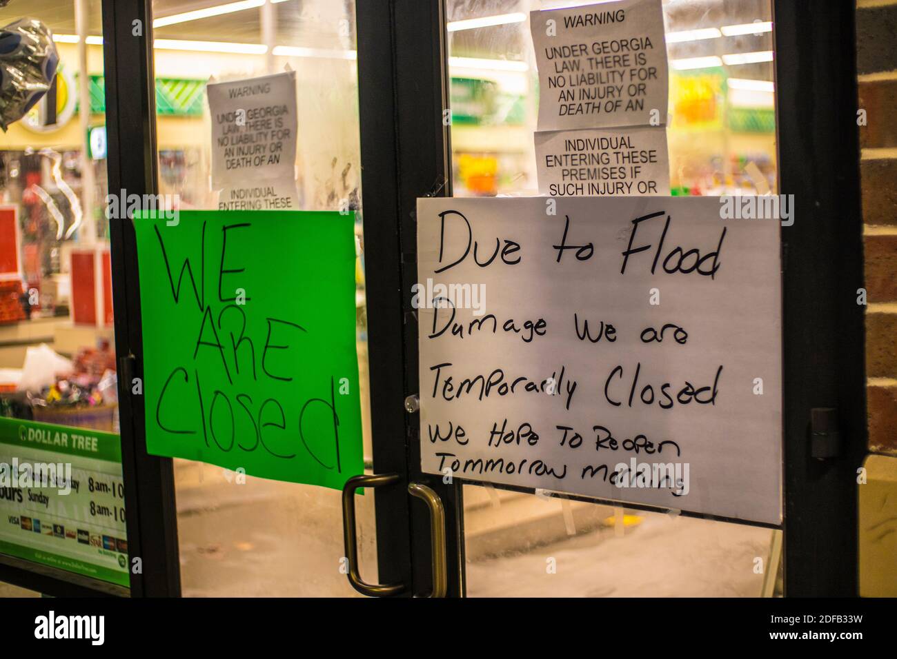 Augusta, Ga USA 12 02 20 Dollar Tree retail store flooding closed front door signs Stock