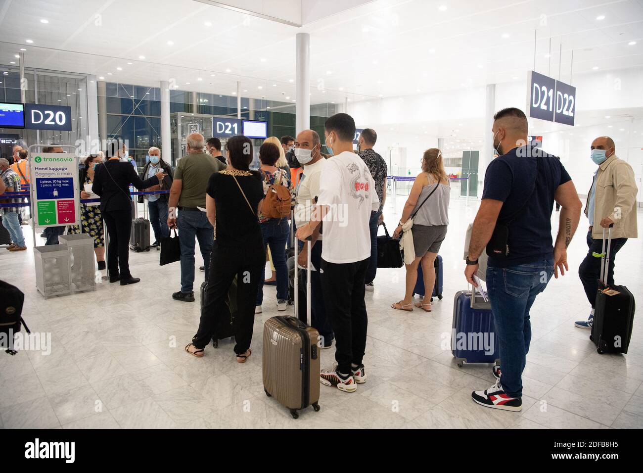 Passengers queue at the luggage drop-off as the Paris' Orly Airport reopens  following the coronavirus disease (COVID-19) outbreak in France, France  June 26, 2020. Photo by David Niviere/ABACAPRESS.COM Stock Photo - Alamy