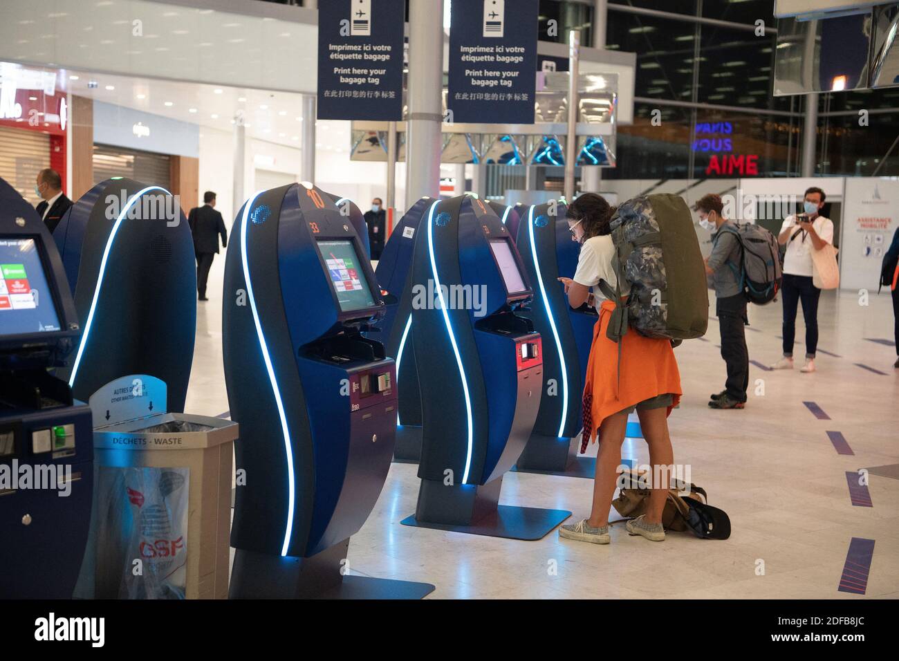 Passenger waits by self-service check-in kiosks at Orly 3 terminal on the  day of the re-opening of Paris' Orly airport on June 26, 2020. Photo by  David Niviere/ABACAPRESS.COM Stock Photo - Alamy